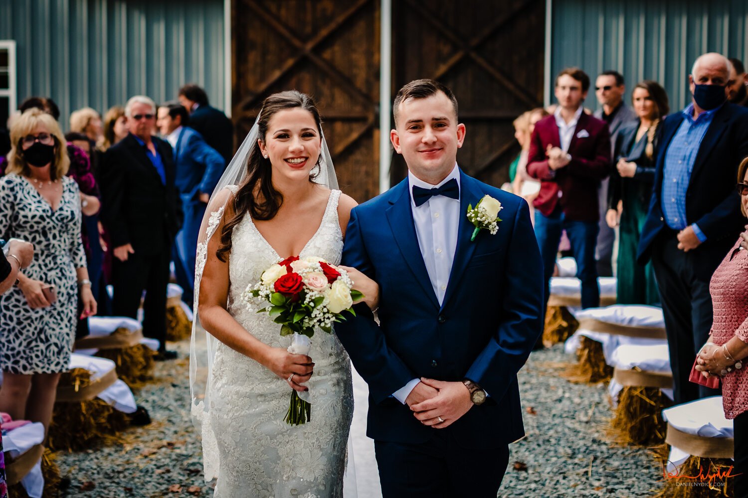 bride and groom walking down the aisle rustic barn nj wedding