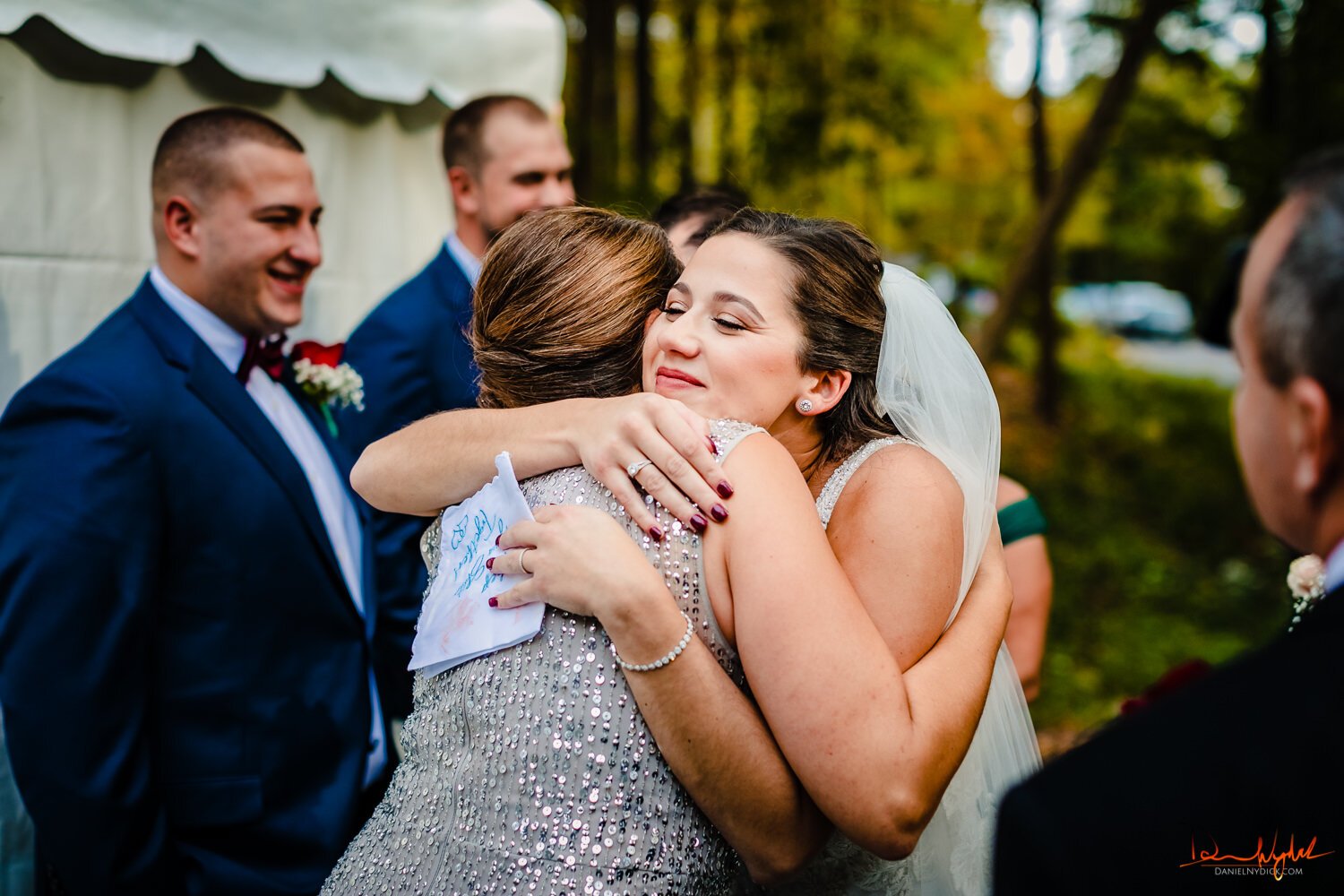 bride hugging mother in law after nj rustic barn wedding