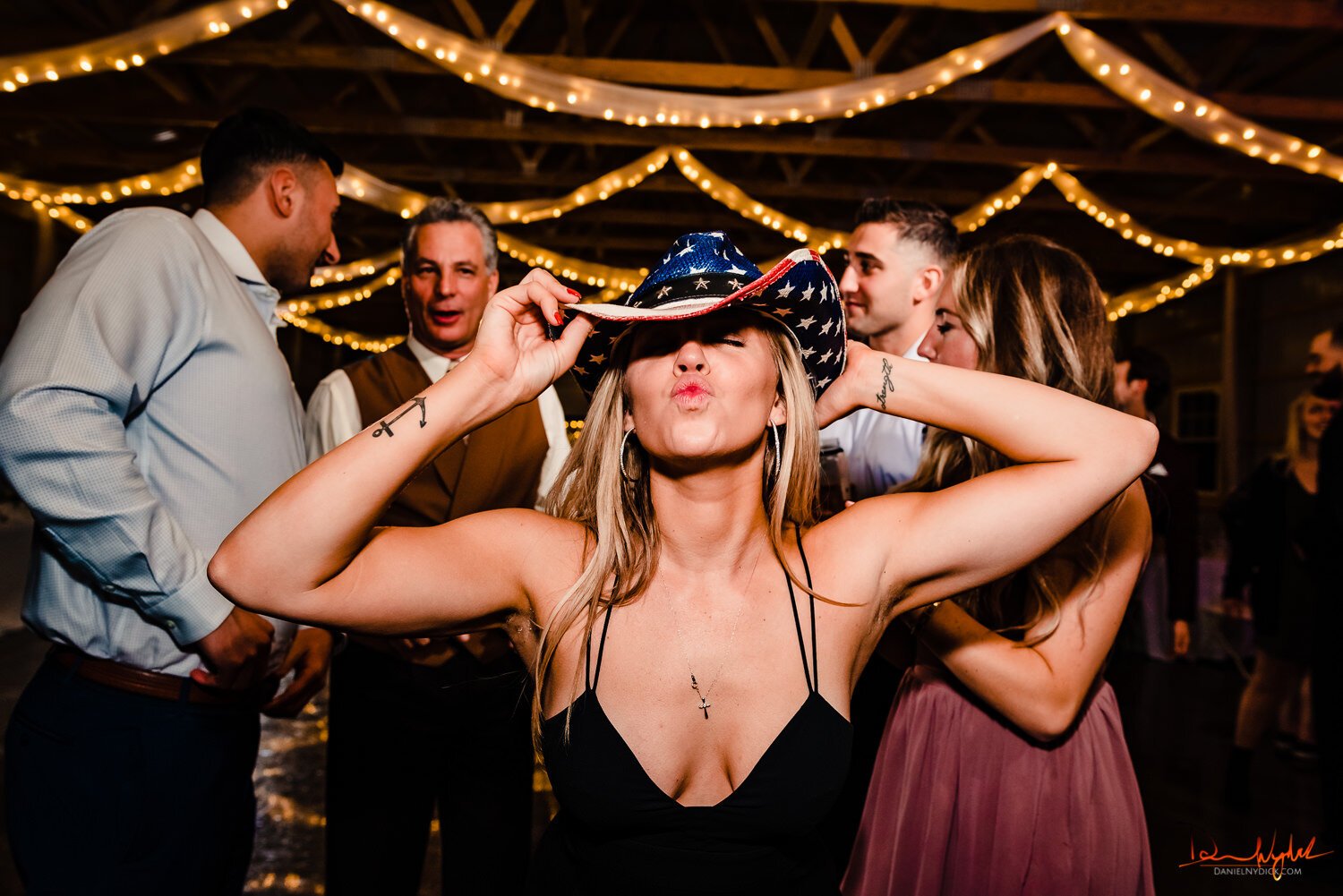 guest at nj wedding with cowboy hat american flag