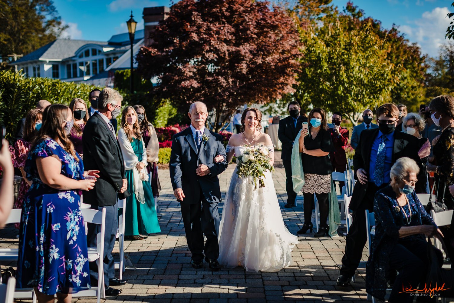 Bride walking down the aisle with father at Mill at Lakeside Man