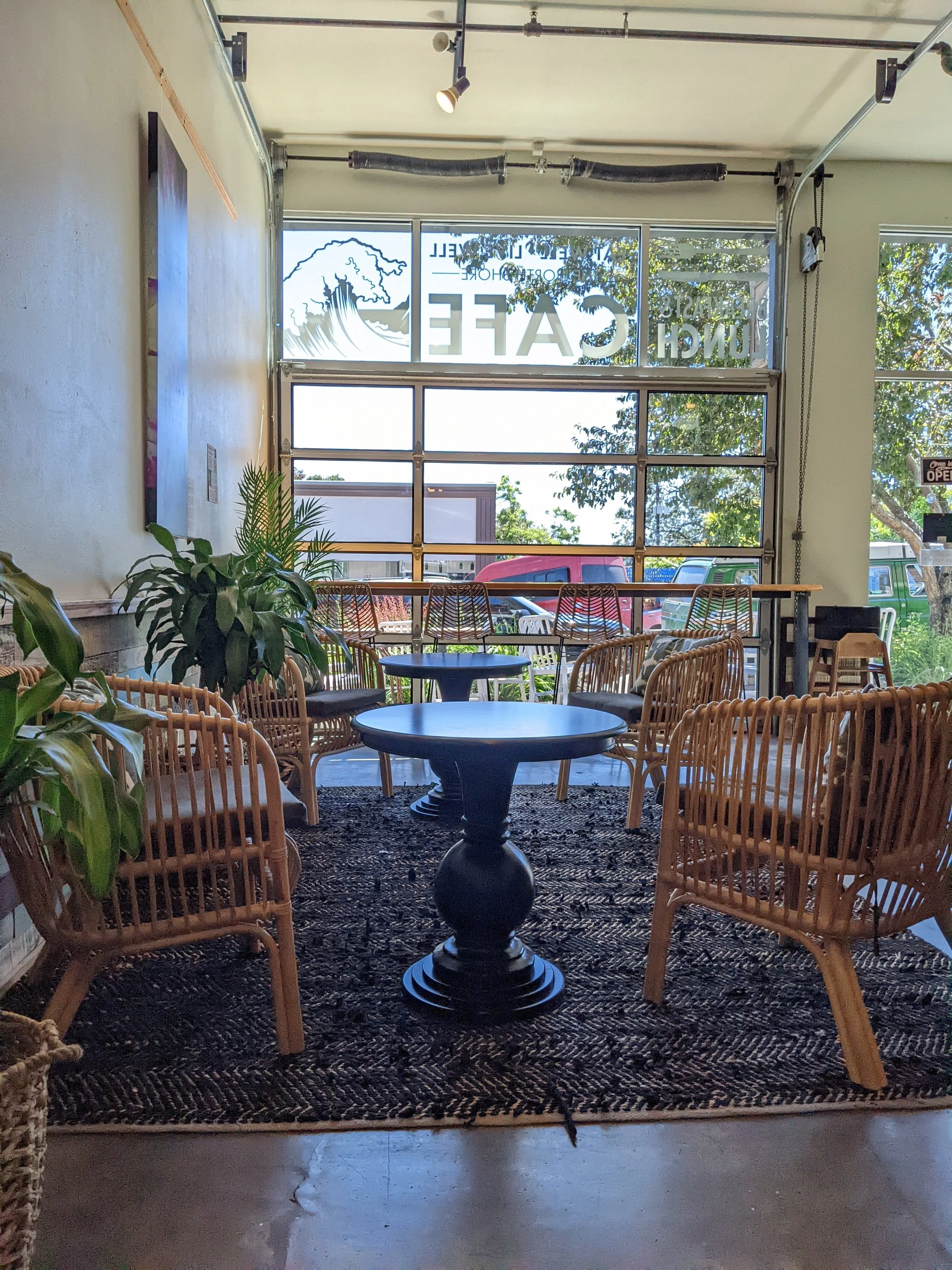 Inviting and loungey seating group at the front entry welcomes guests to grab their cup and enjoy the ambiance. 