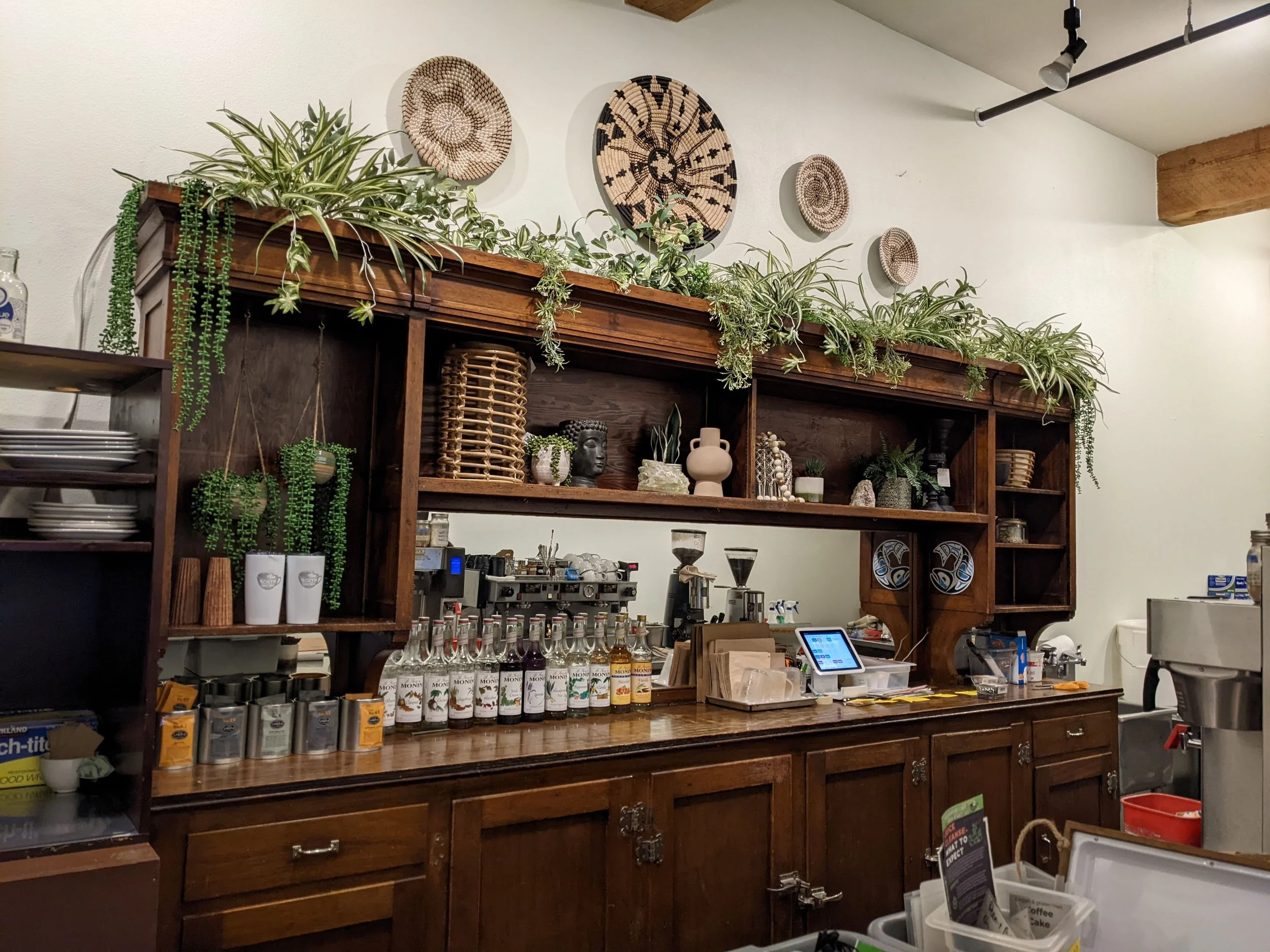 Carefully curated accessories and faux plants brings this antique curio cabinet back to life. 