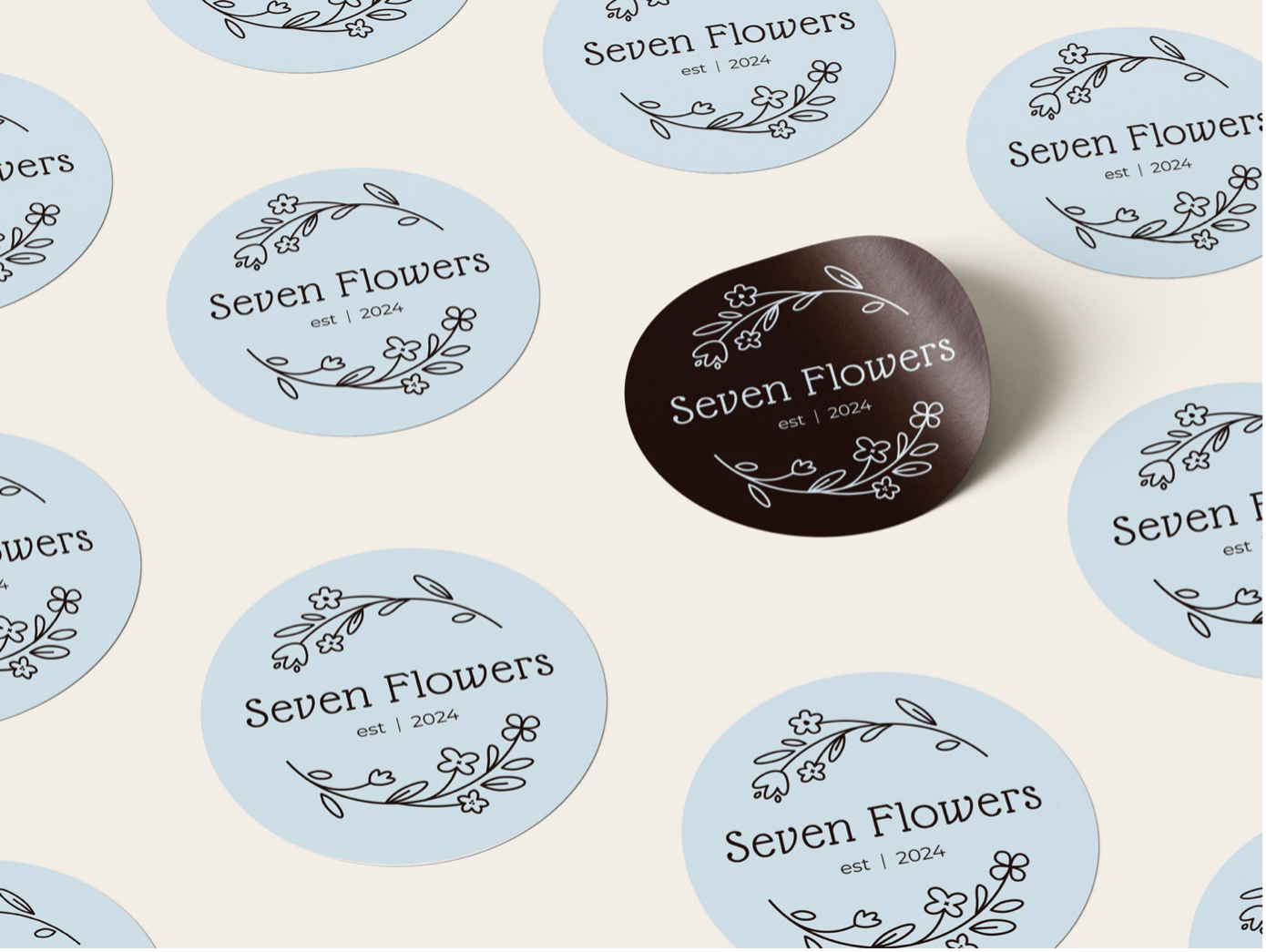 An image of stickers with the Seven Flowers logo