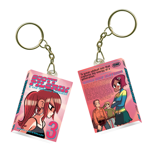 Two keychains with cards from the comic 'Scoot and Doodle,' featuring cartoon characters and text.