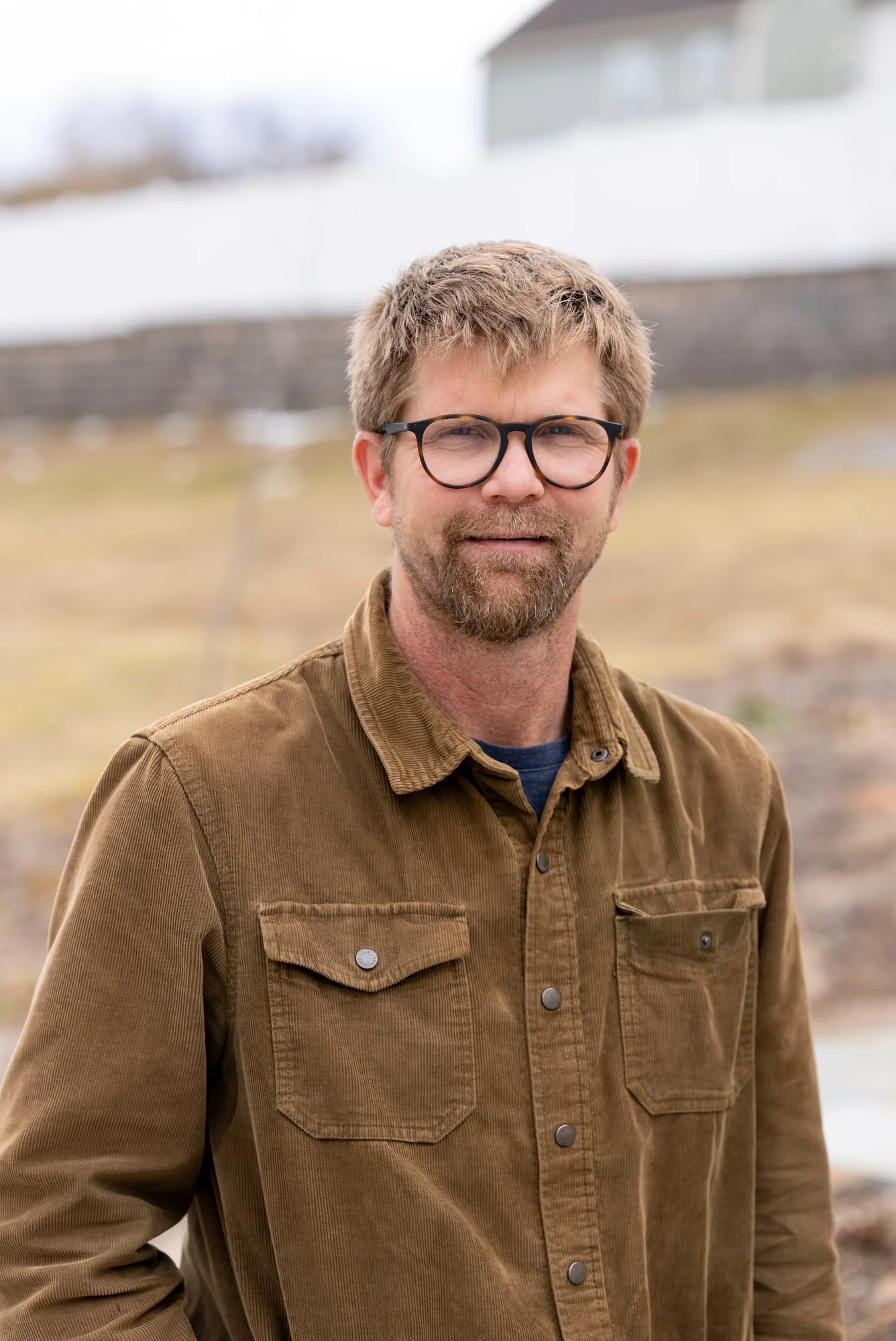 image of a man with black glasses