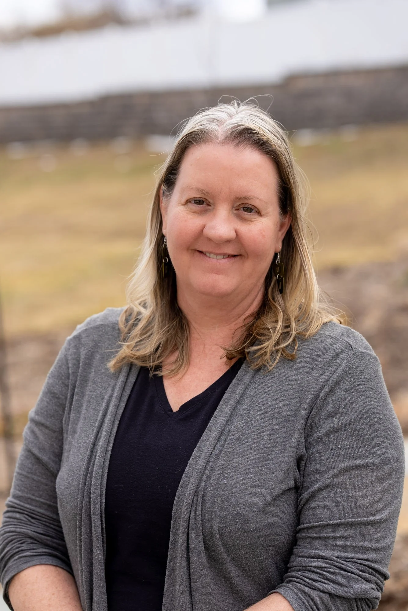 image of a woman with a gray cardigan