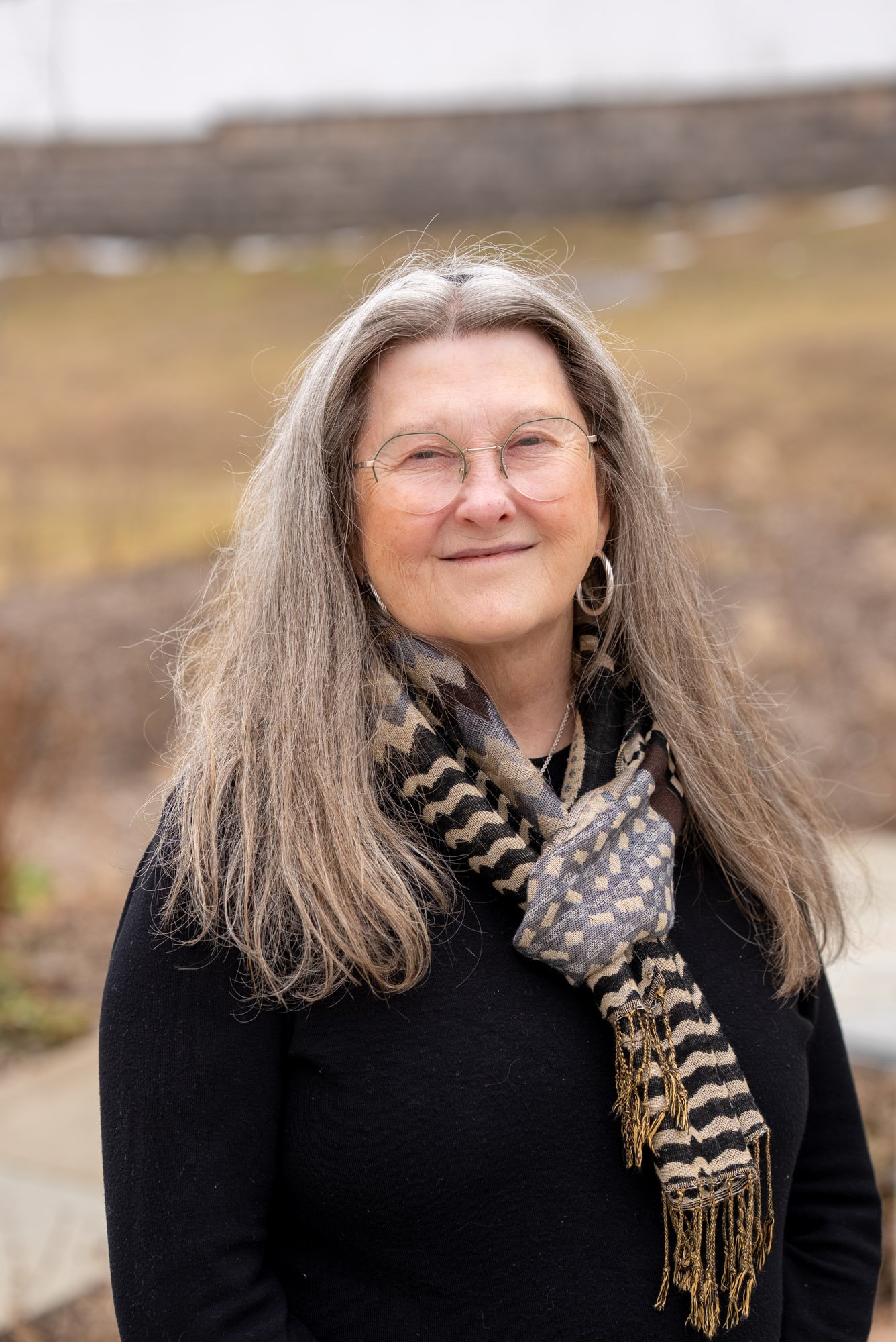 image of a woman with a brown and black scarf