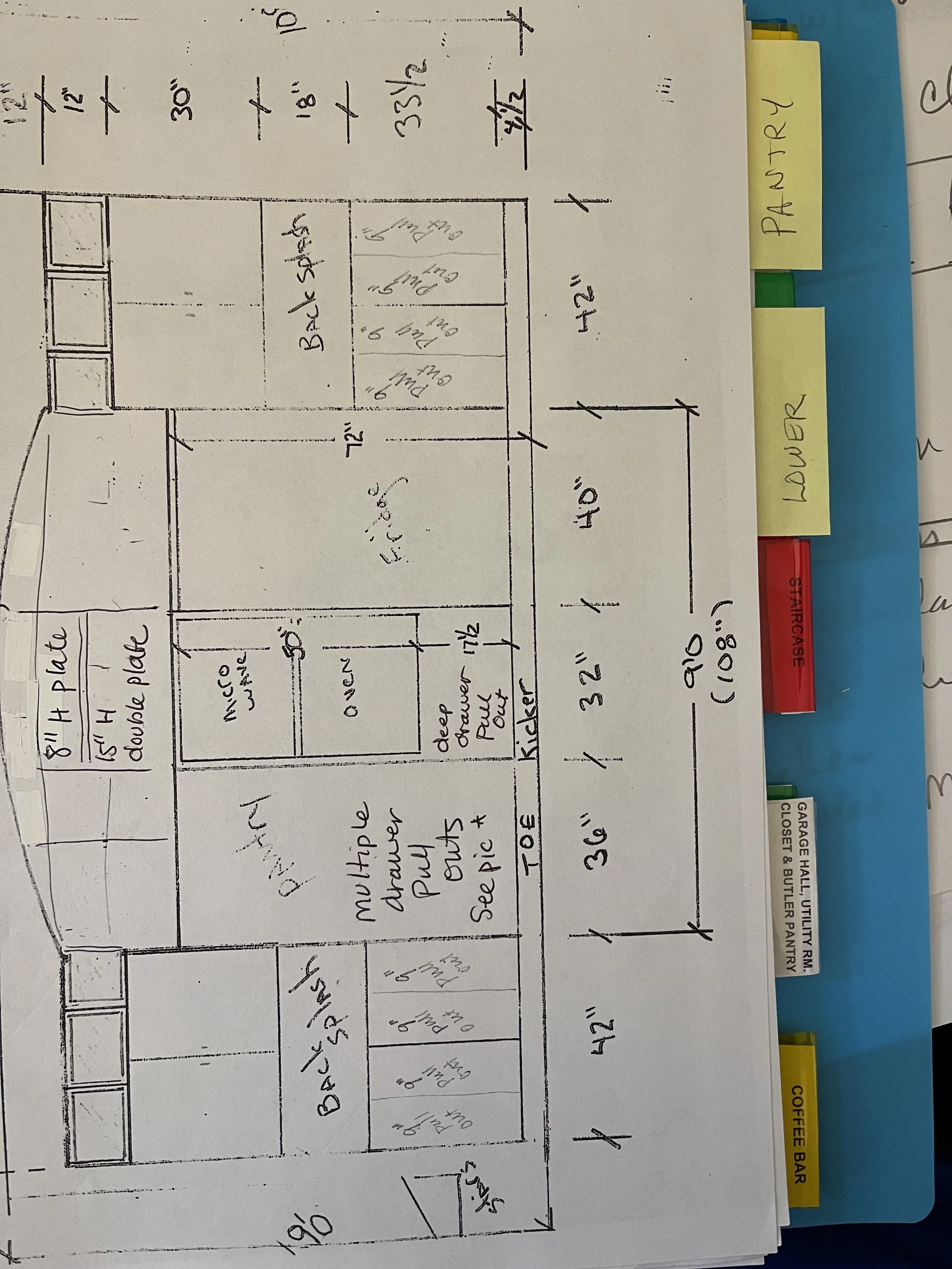 Hand-drawn kitchen layout with labeled cabinets, drawers, and appliances, including a double sink, a dual oven, a microwave, a deep drawer pantry, and a refrigerator, with dimensions and notes for construction.