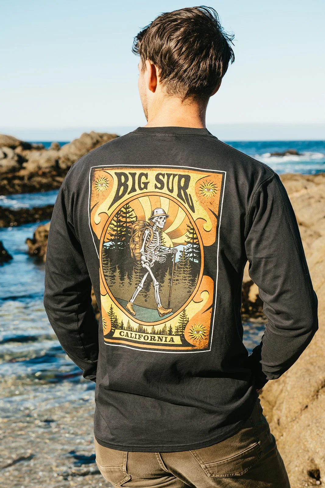 BigSurRiverInn-BigSur-GeneralStore-SkeletonHiking-LongSleeve-Back-Male-PfeifferBeach-HannahOvereemPhoto.jpeg