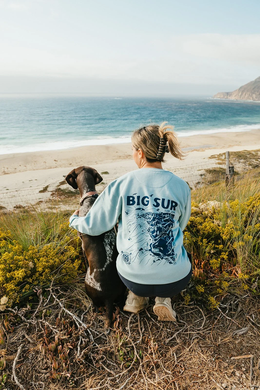 BigSurRiverInn-BigSur-GeneralStore-BigSurSurfMap-CrewNeck-Back-Female-Map-LittleSurWithDog-HannahOvereemPhoto.jpeg