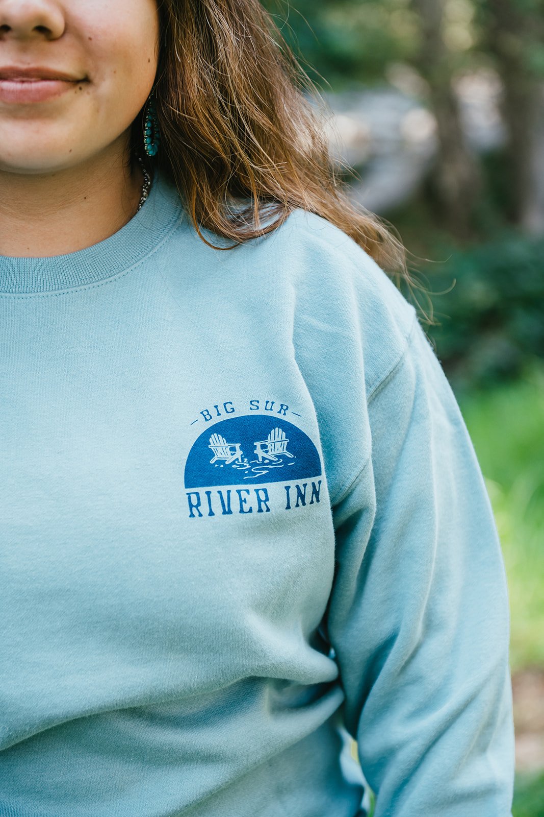 BigSurRiverInn-BigSur-GeneralStore-BigSurSurfMap-CrewNeck-Front-Female-PatchWideShot-BSRILawn-HannahOvereemPhoto.jpeg