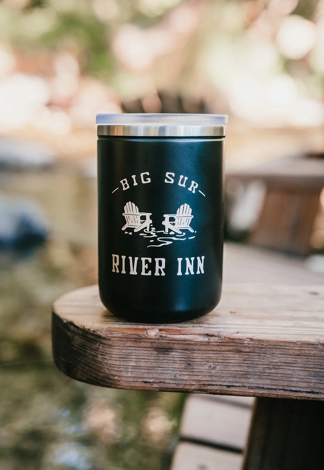BigSurRiverInn-BigSur-GeneralStore-11ozBSRILogoMetalTumbler-Black-Front-AdirondackChairInRiver-HannahOvereemPhoto.jpeg