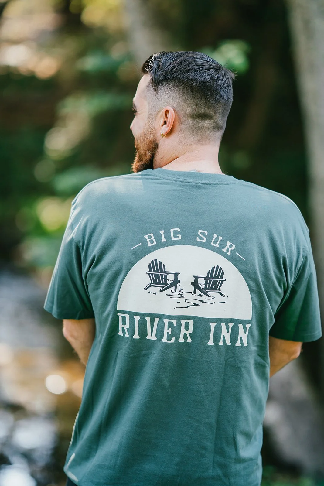 BigSurRiverInn-BigSur-GeneralStore-BSRILogo-ShortSleeve-Green-Back-Male-FullView-BigSurRiver-HannahOvereemPhoto.jpg