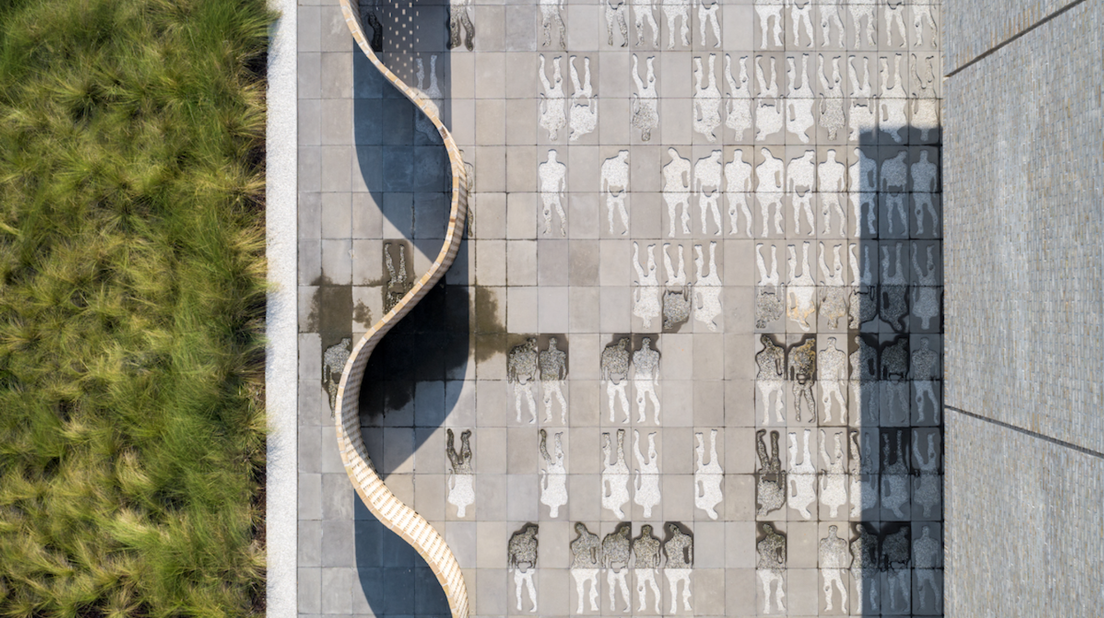  Water-washed figures in Tide Tribute, an exterior introduction to the International African American Museum, commemorate the captive Africans who did not survive the grueling journey from their homelands to America. Photograph by Sahar Coston-Hardy;