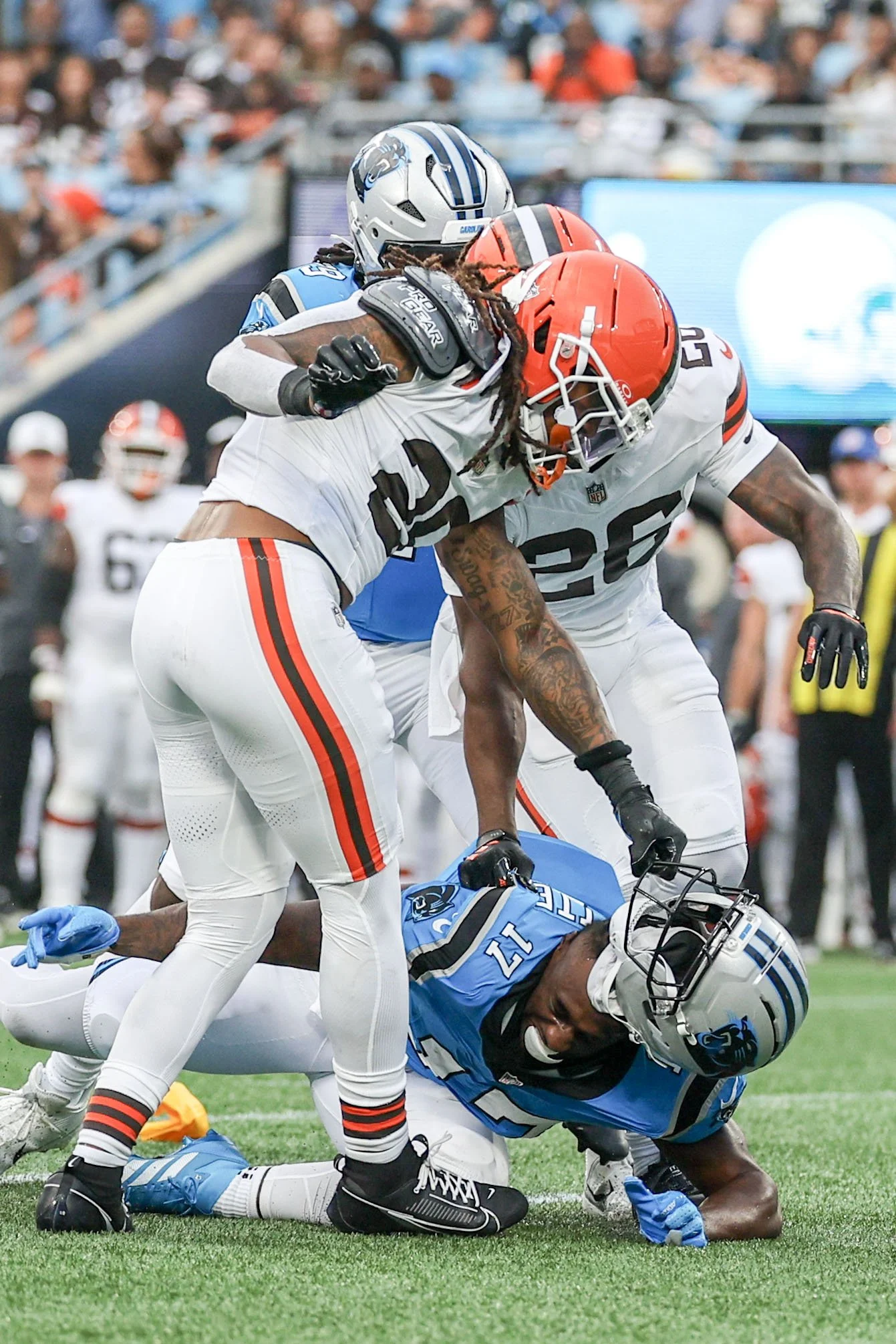 Cleveland Browns safety Rayshawn Jenkins rips off Carolina Panthers wide receiver Xavier Legette's helmet during the August 8 preseason game at Bank of America Stadium.
(Lila Turner/The Charlotte Observer)
