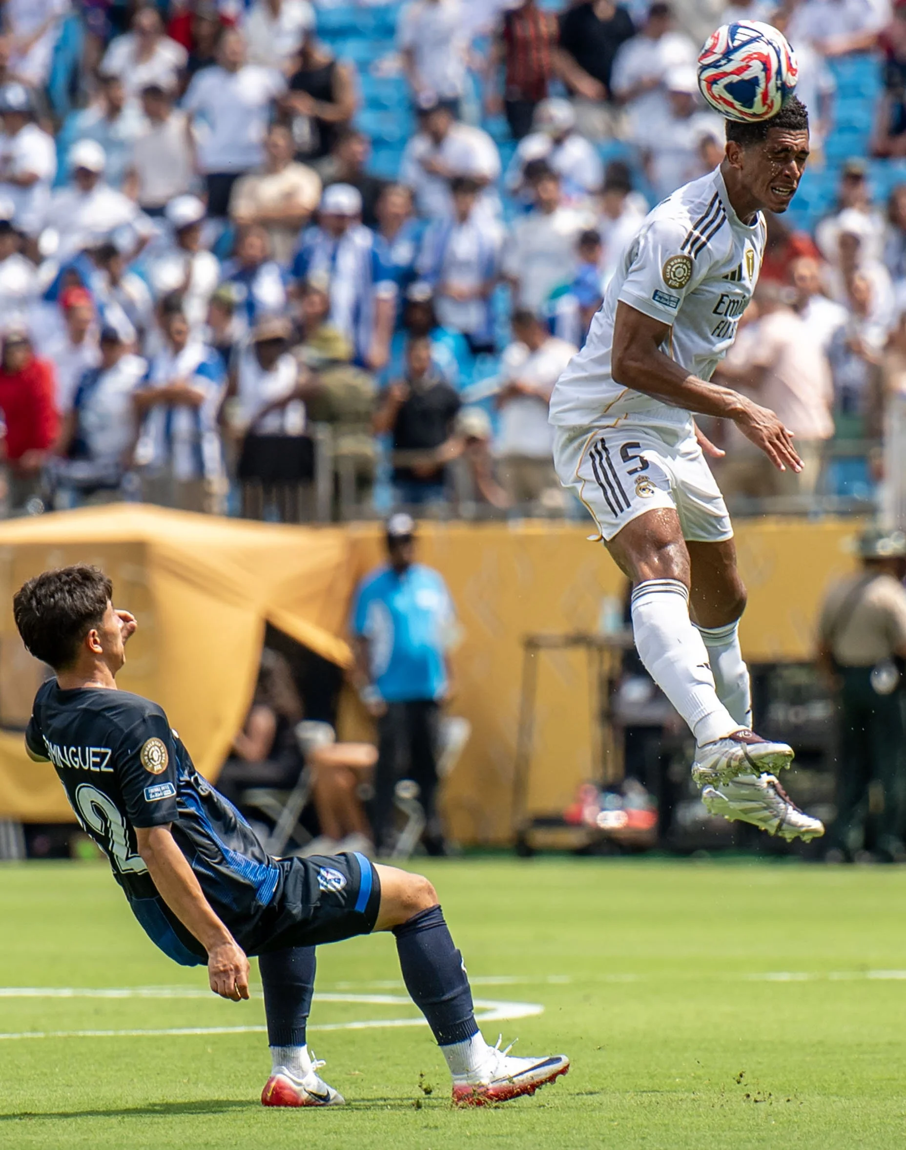 Real Madrid midfielder Jude Bellingham heads the ball past a Pachuca defender during the FIFA Club World Cup game between Real Madrid and Pachuca in Charlotte, NC, Sunday, June 22, 2025.