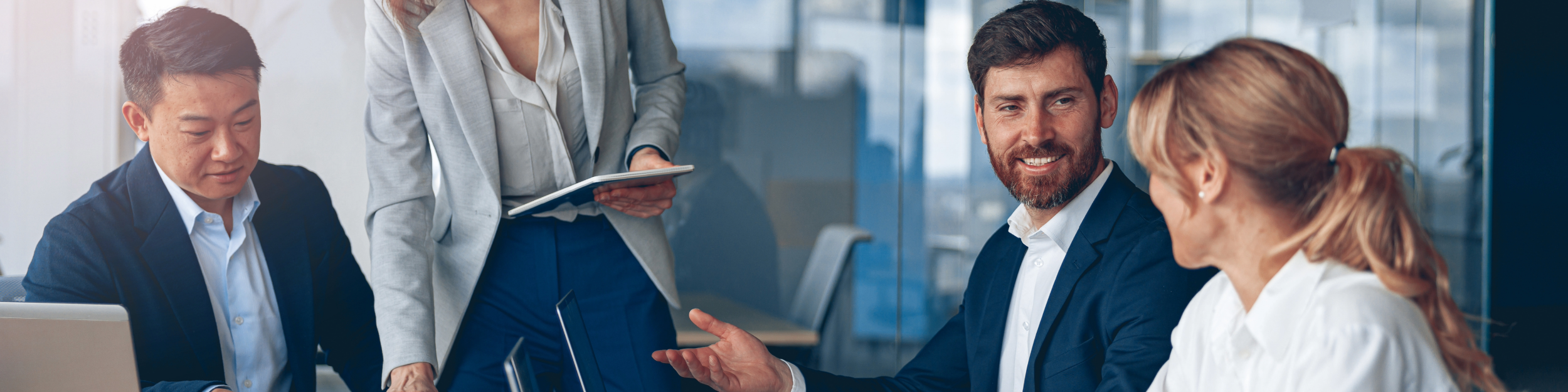 Business professionals in a meeting having a discussion.