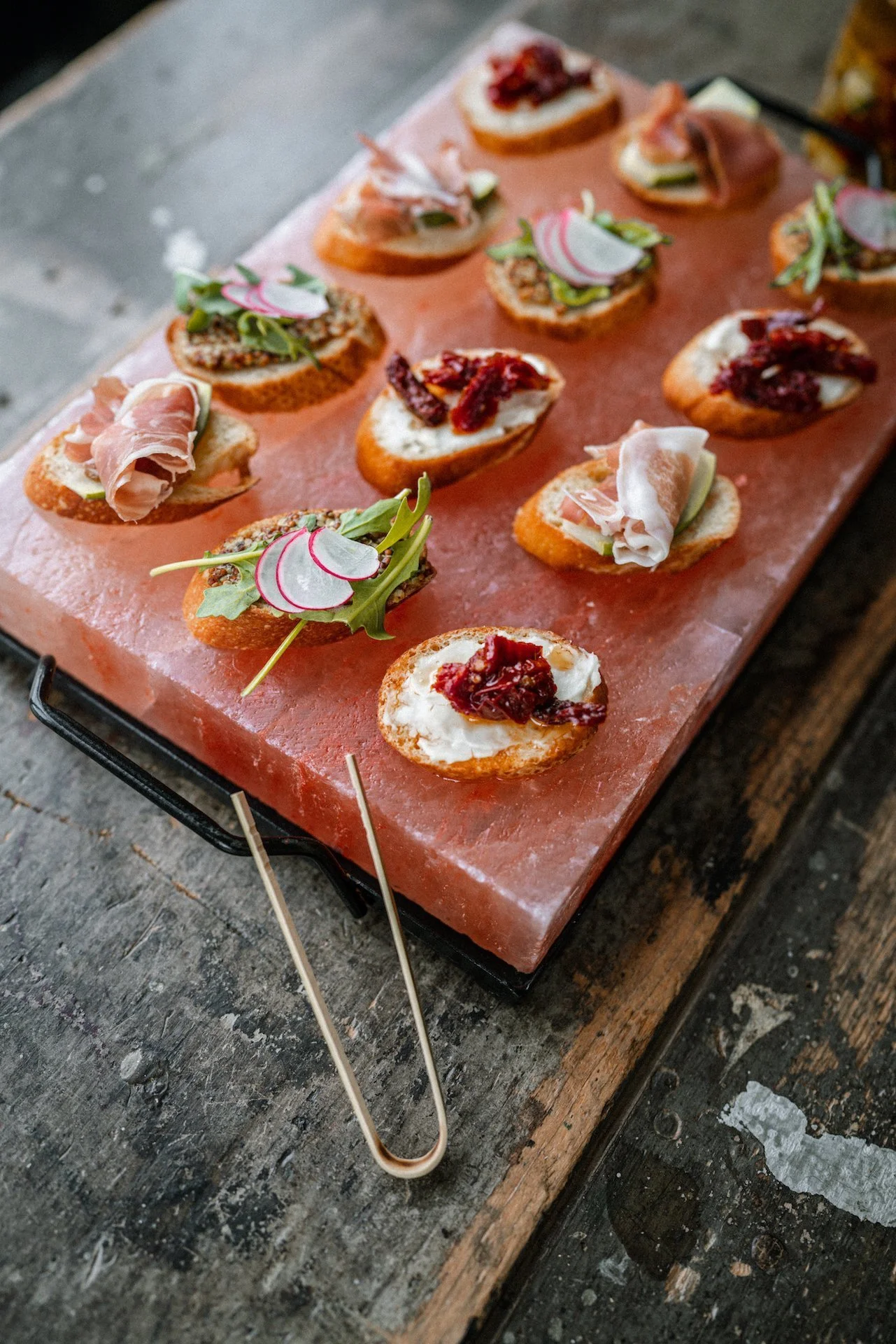 Small open-faced appetizers with colorful toppings