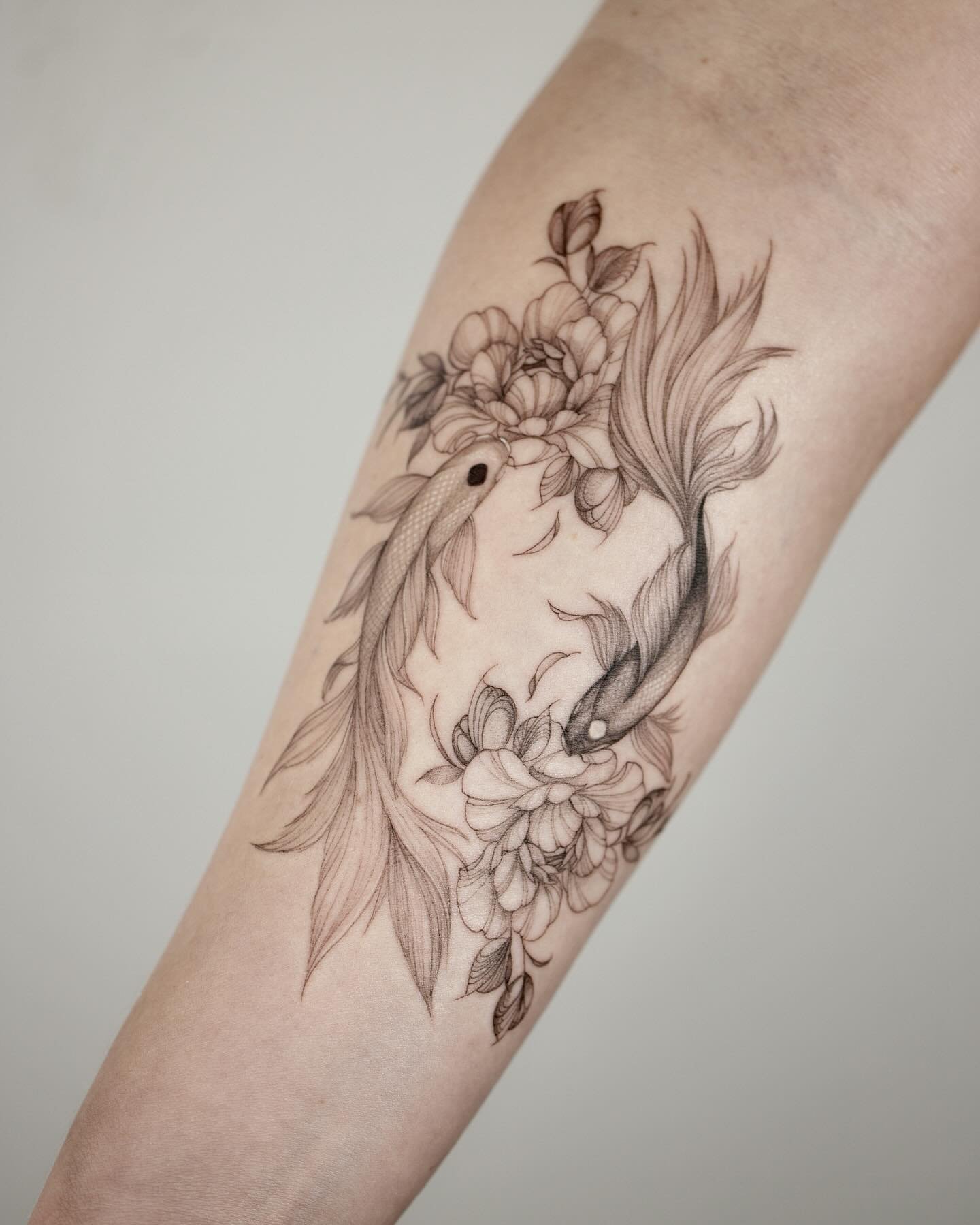Two koi, endlessly circling&mdash;symbolizing balance, resilience, and the quiet strength in movement. 💫

Soft, feathered fins drift like whispers, while delicate peonies and falling leaves anchor the design in grace and stillness. 🍃

A dainty, flo