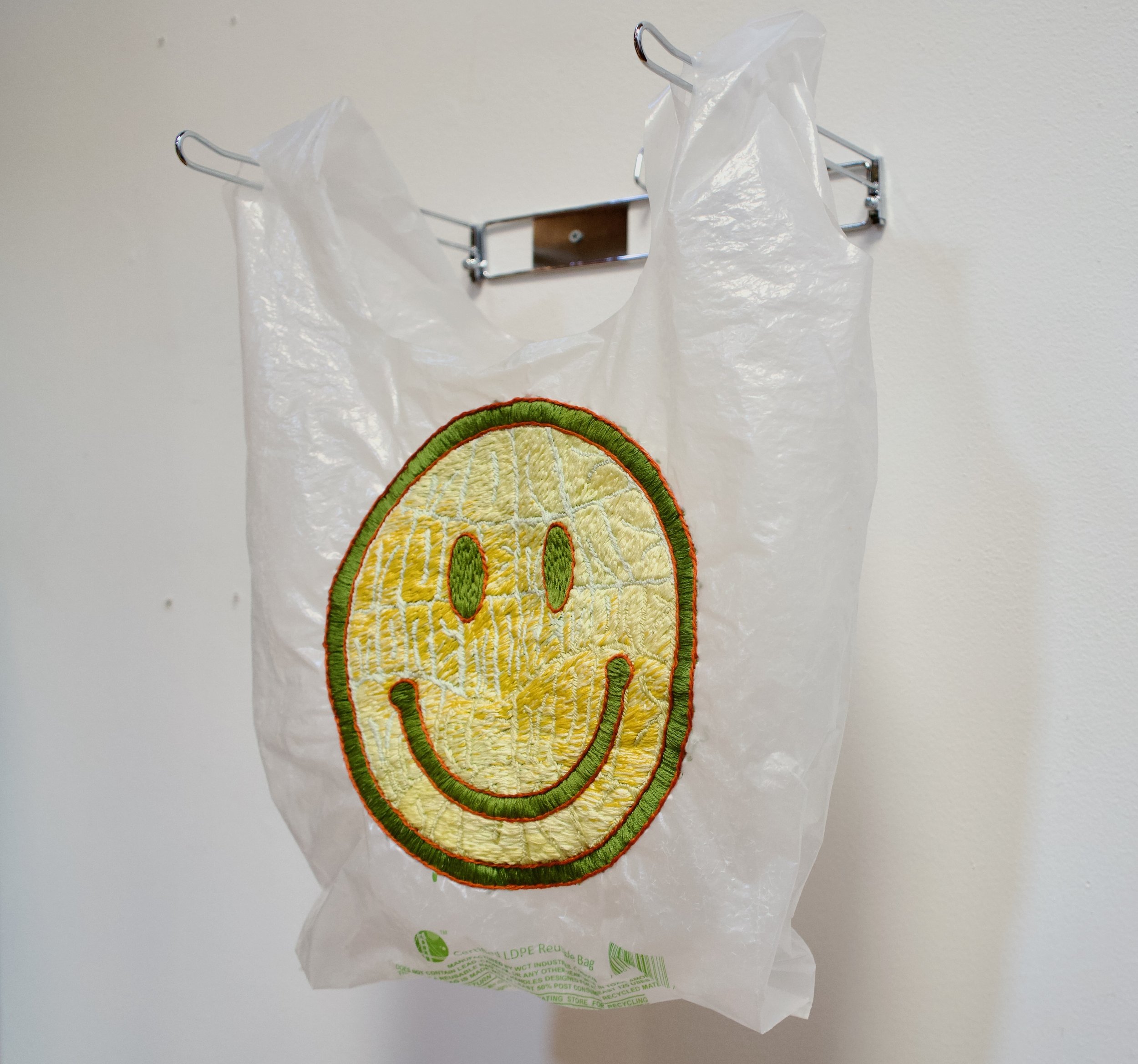 More More More, 2021. Hand embroidery on plastic bag.