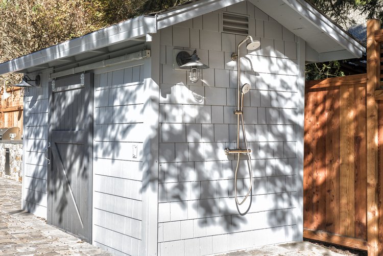  A small shed with an outdoor shower.  
