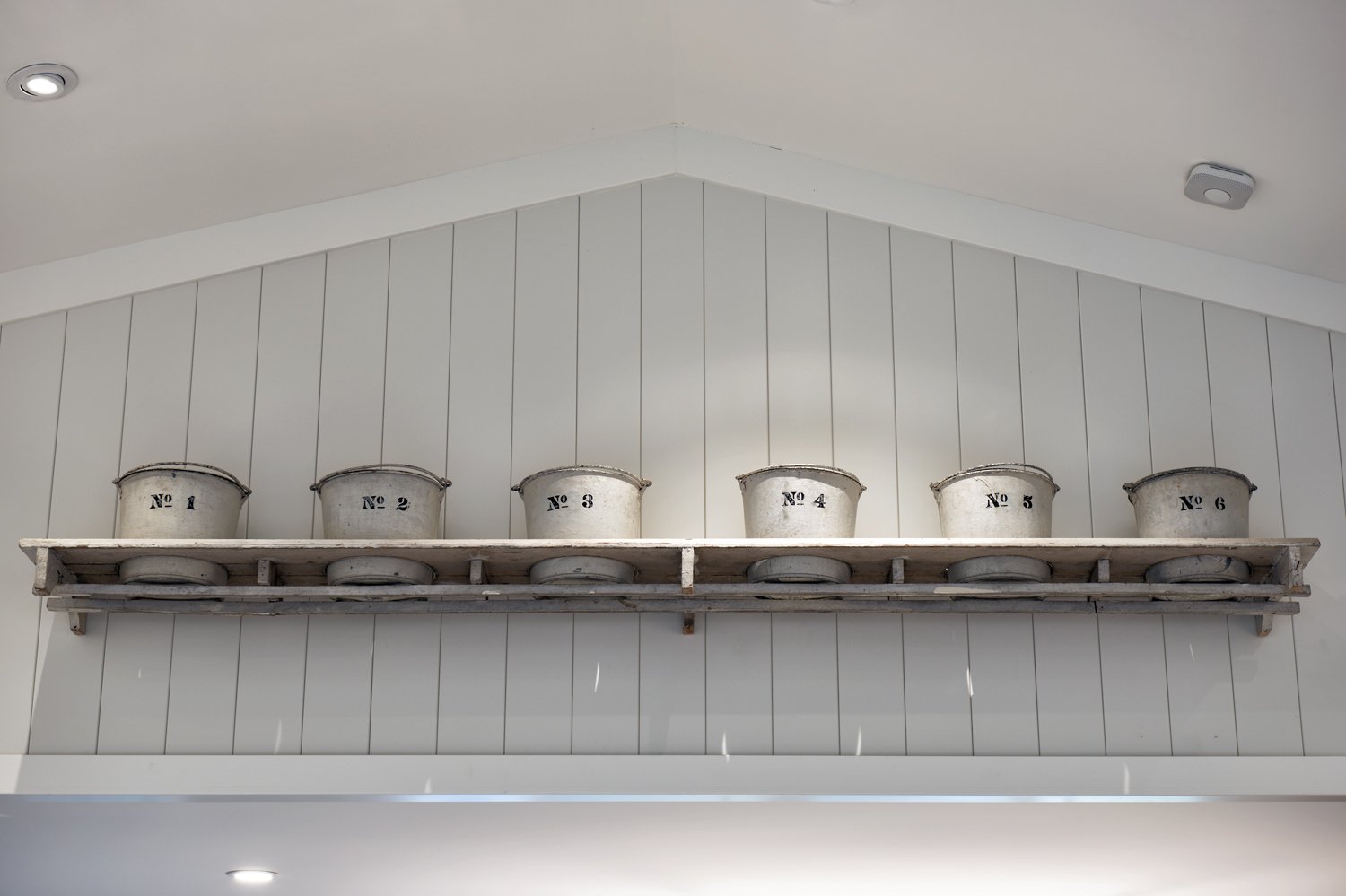  A shelf with antique pots.  