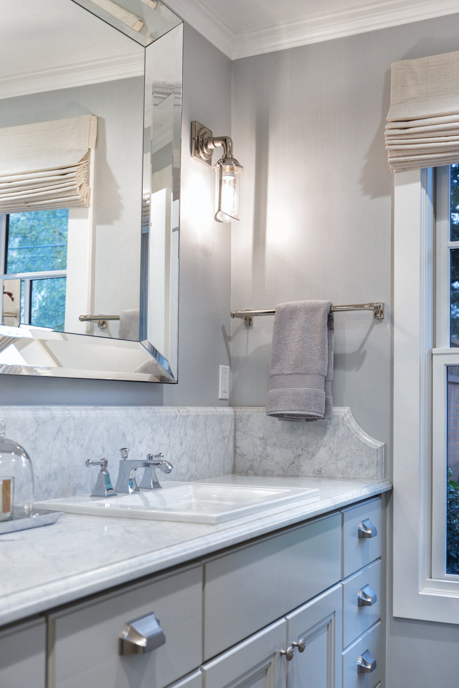  A bathroom vanity with marble countertops.  