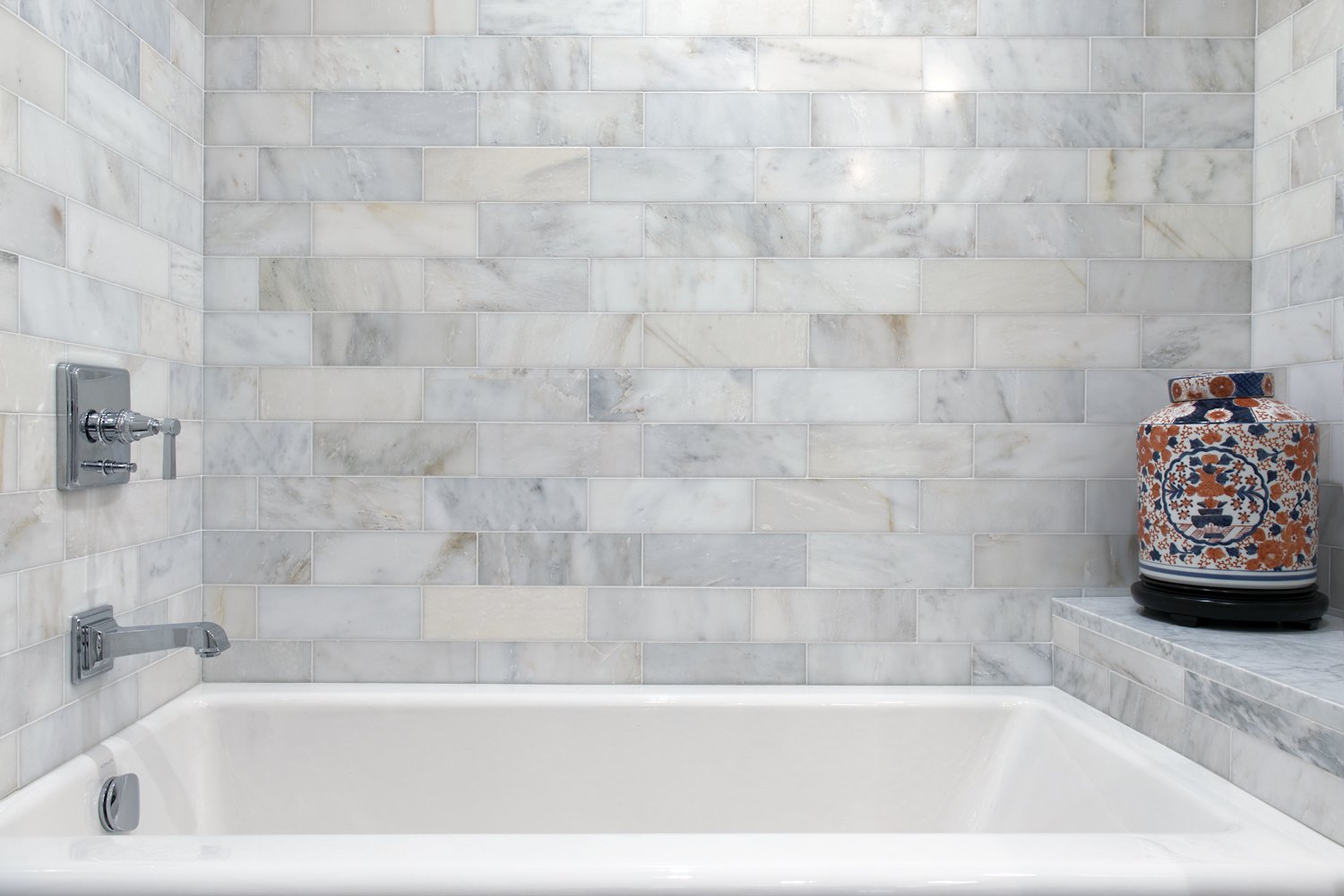  Bathtub with tiled walls.  