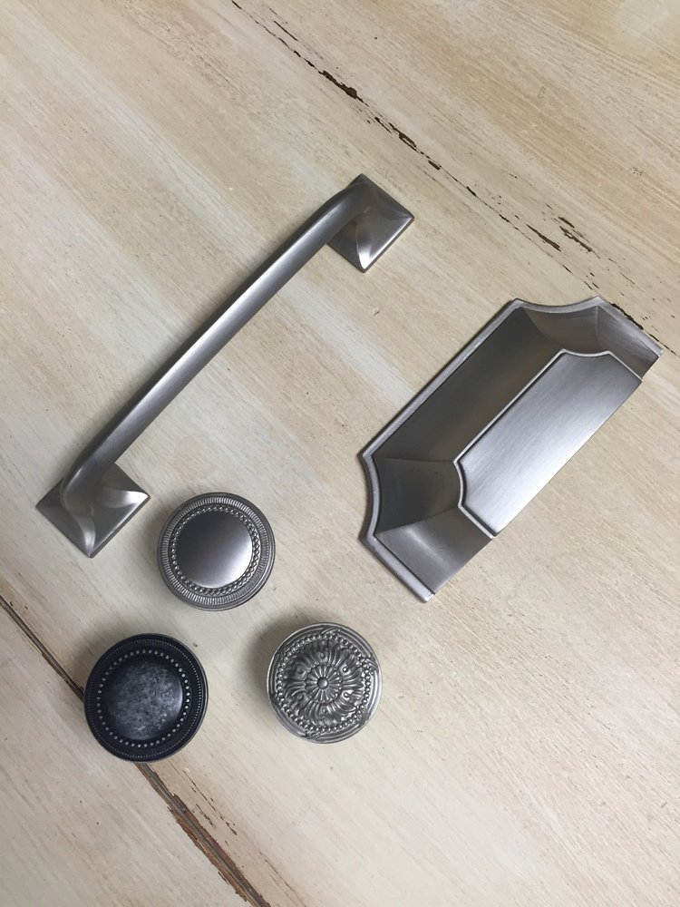  Silver and black cabinet pulls.  