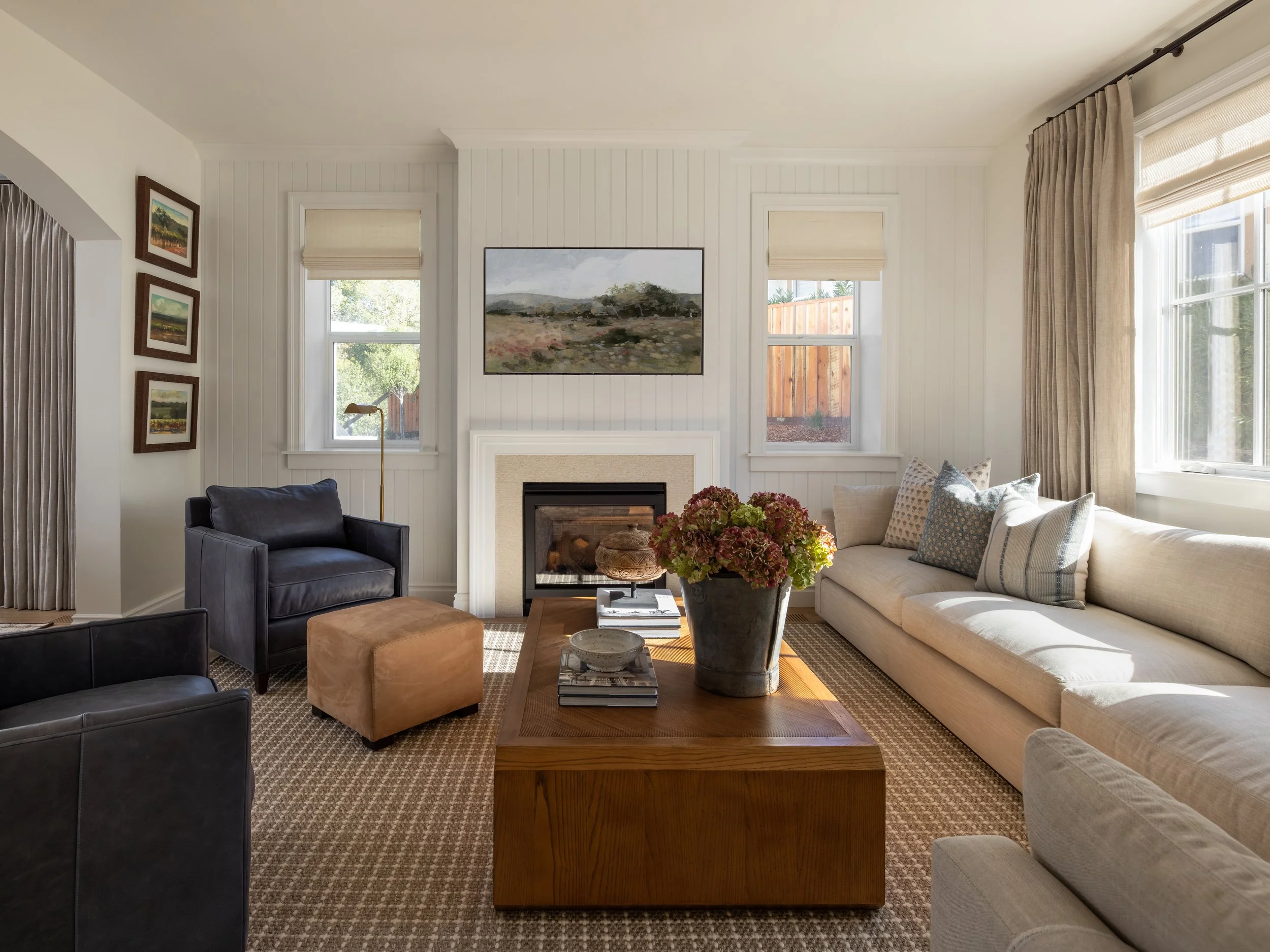 Transitional living room with shiplap fireplace, navy leather chairs, and linen sofa — Bartlett Residence by Tama Bell Design, Ukiah CA