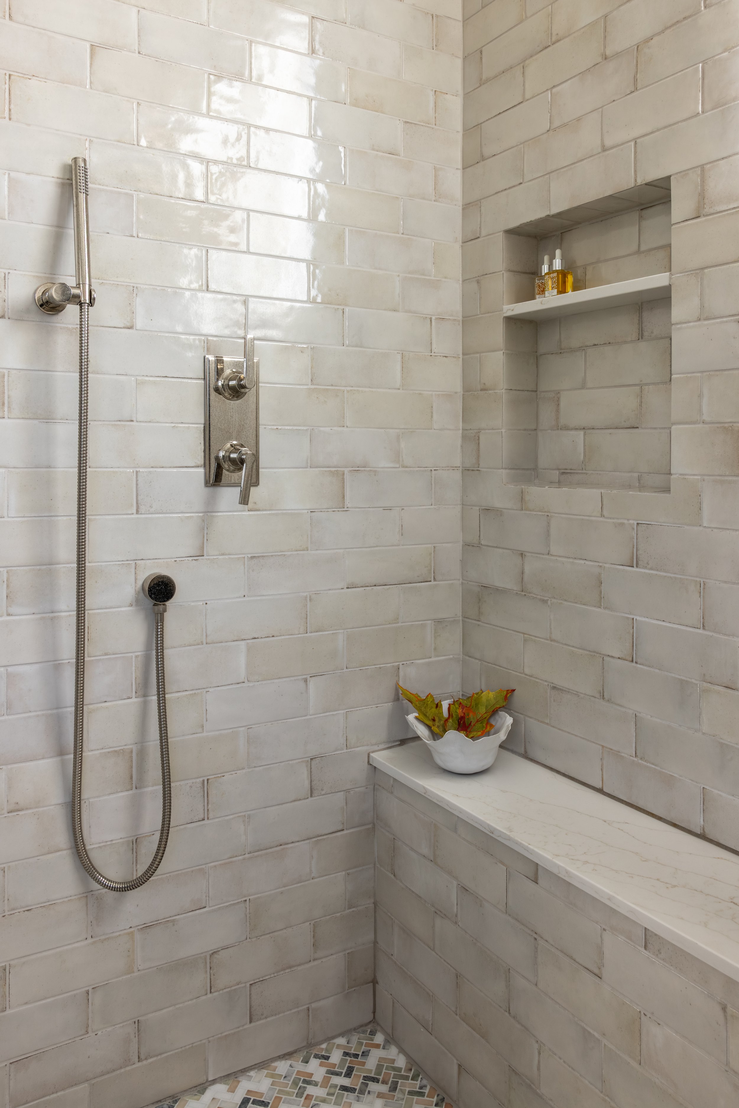 Primary bathroom walk-in shower with handmade subway tile, built-in bench, and built-in niche — Bartlett Residence by Tama Bell Design, Ukiah CA