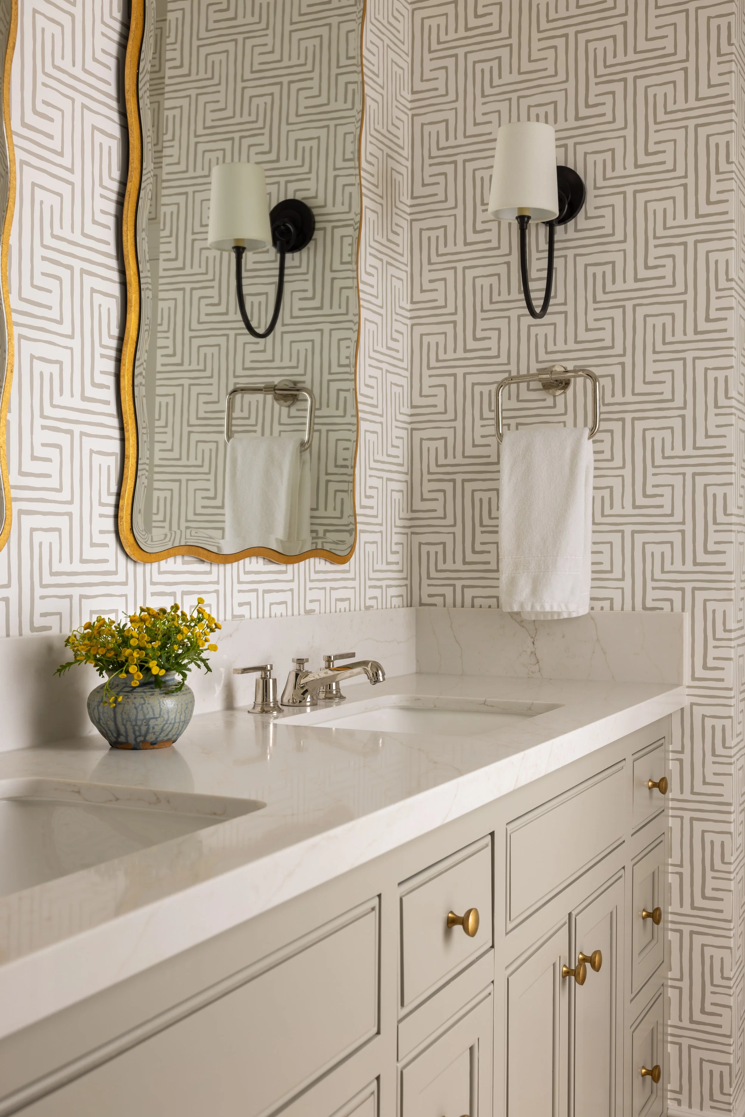 Bathroom vanity detail with geometric wallpaper, gold scalloped mirror, and white quartz countertop — Bartlett Residence by Tama Bell Design, Ukiah CA