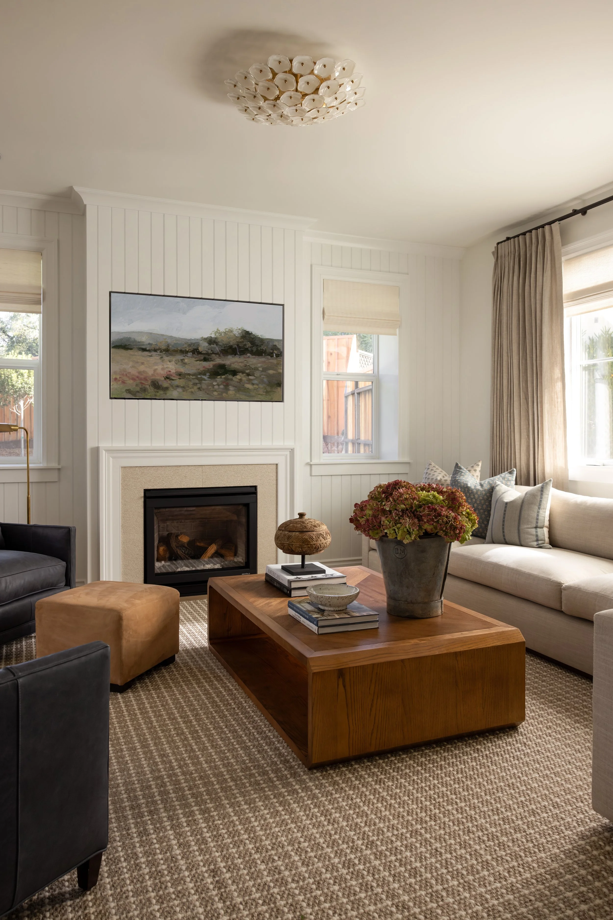 Transitional living room with shiplap fireplace, navy leather chairs, and linen sofa — Bartlett Residence by Tama Bell Design, Ukiah CA
