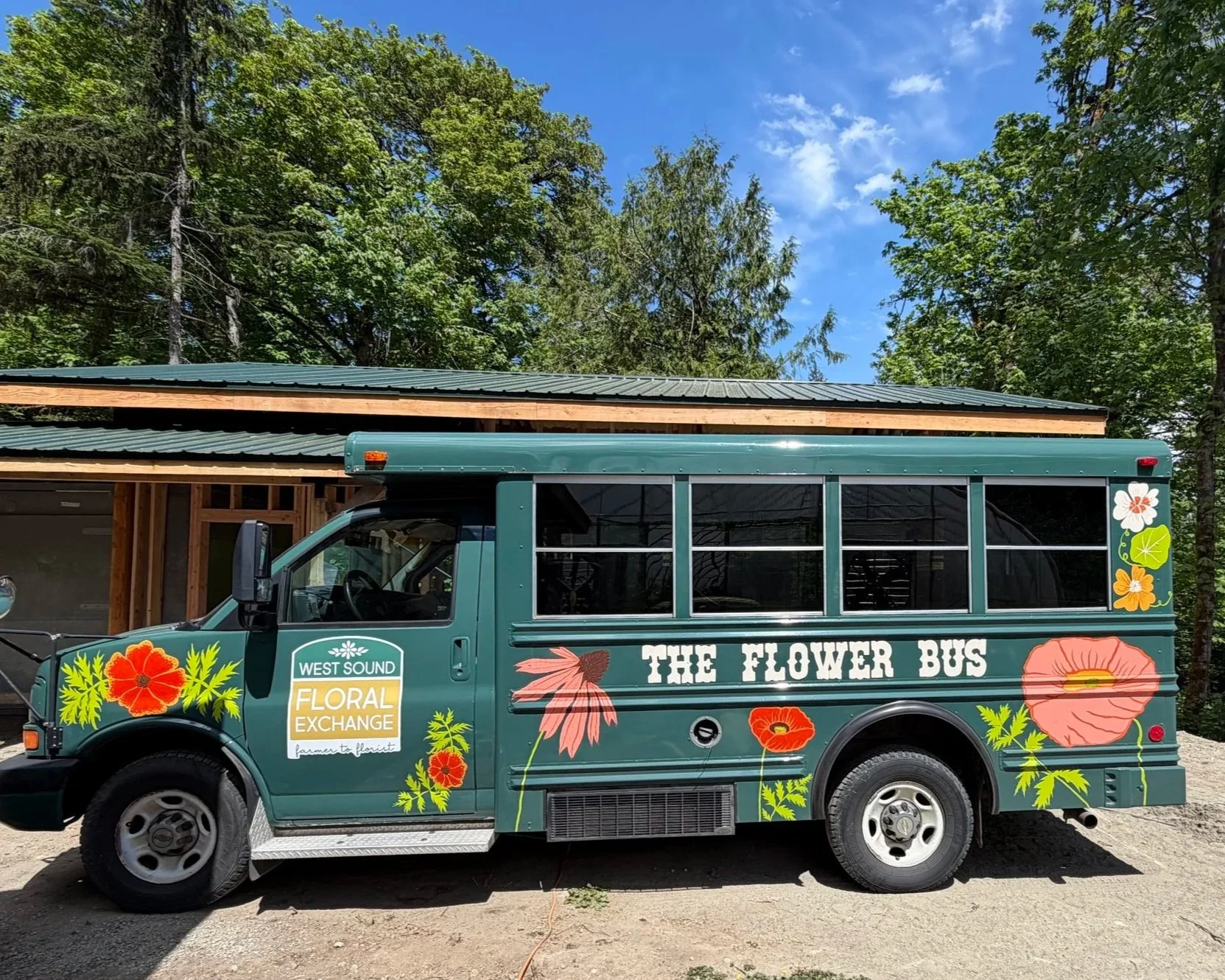 A side view of The Flower Bus with the West Sound Floral Exchange Decal