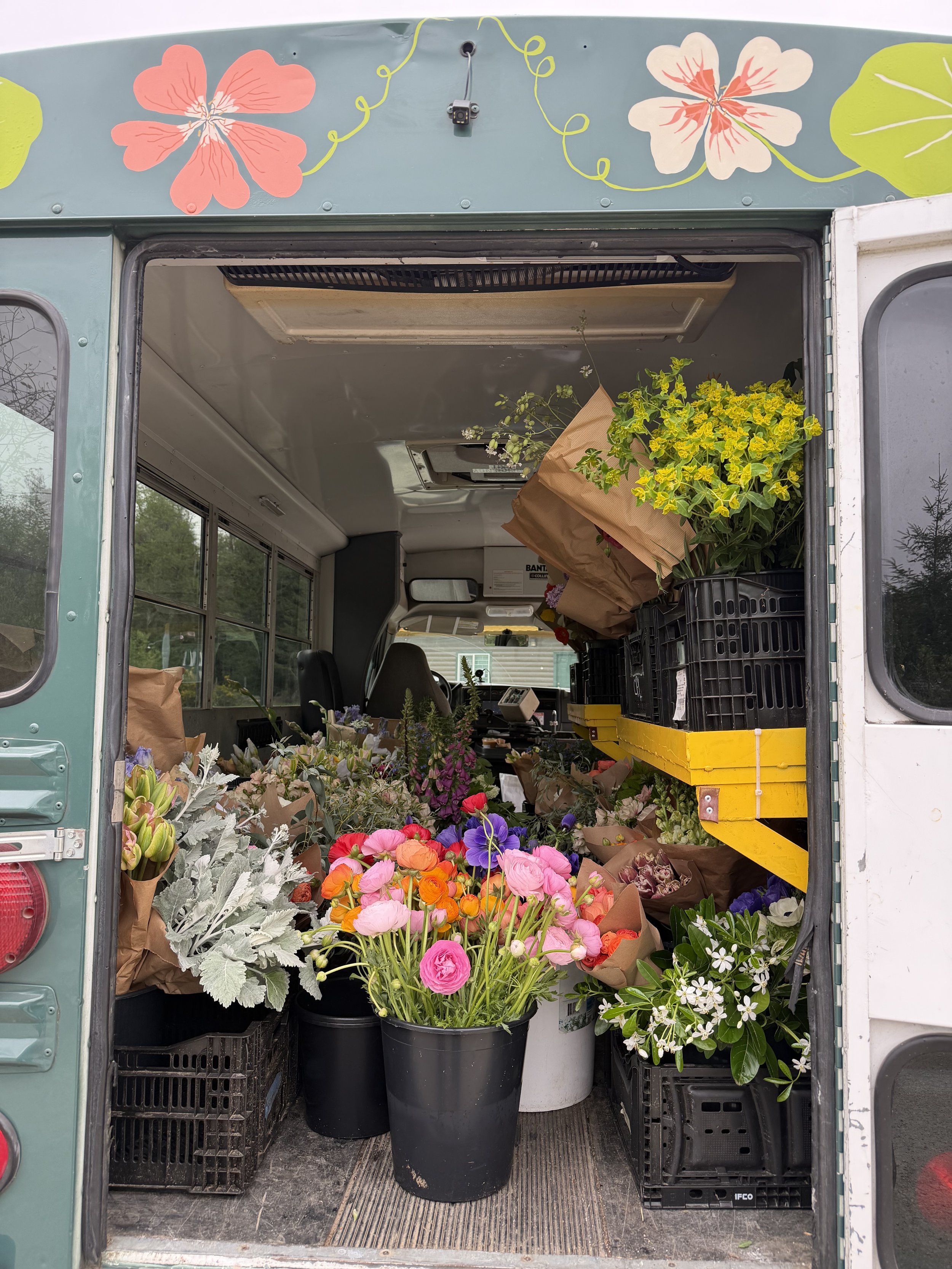 The Flower Bus full of flowers for delivery