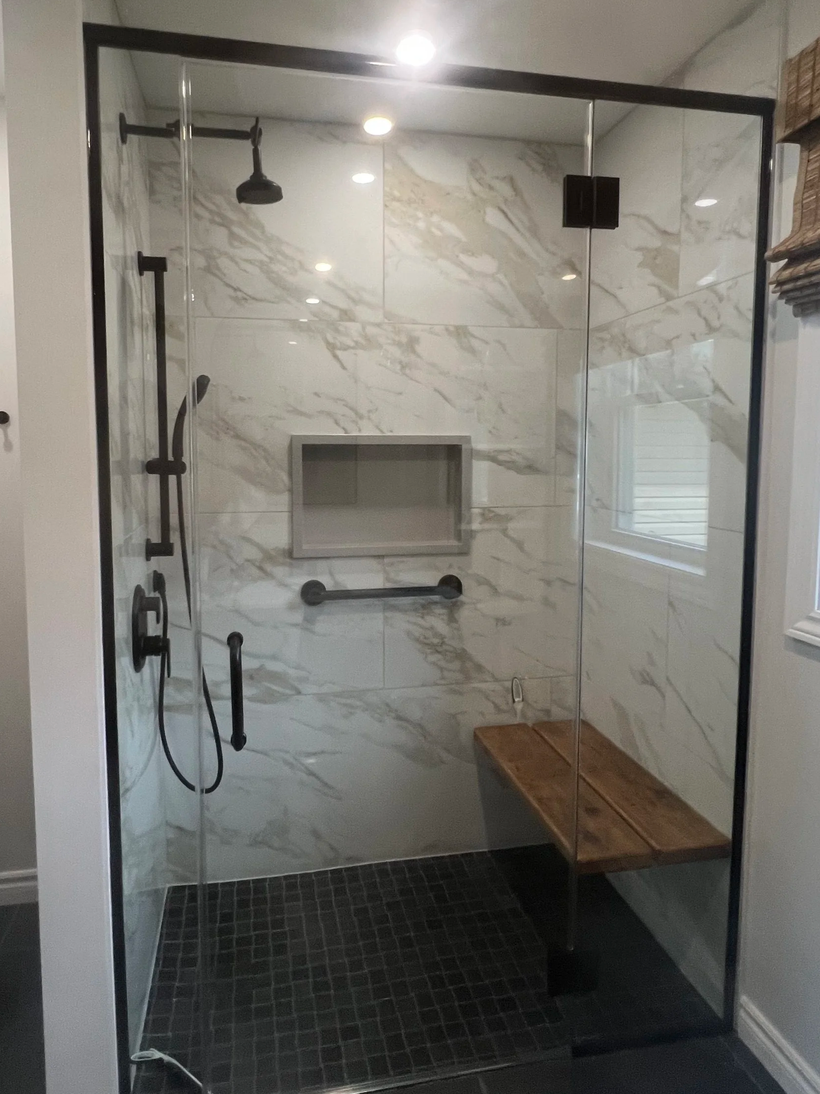 Custom walk-in tile shower completed by Total Quality Contracting in Sault Ste. Marie, Ontario