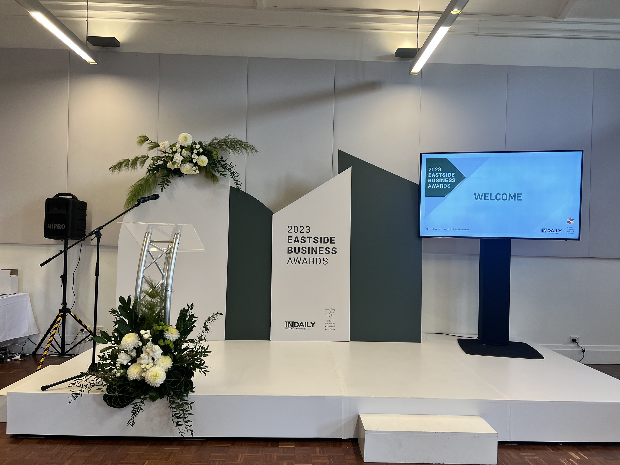 Backdrop - Geometric and Curved Panels, custom wrapped and florals e.jpg
