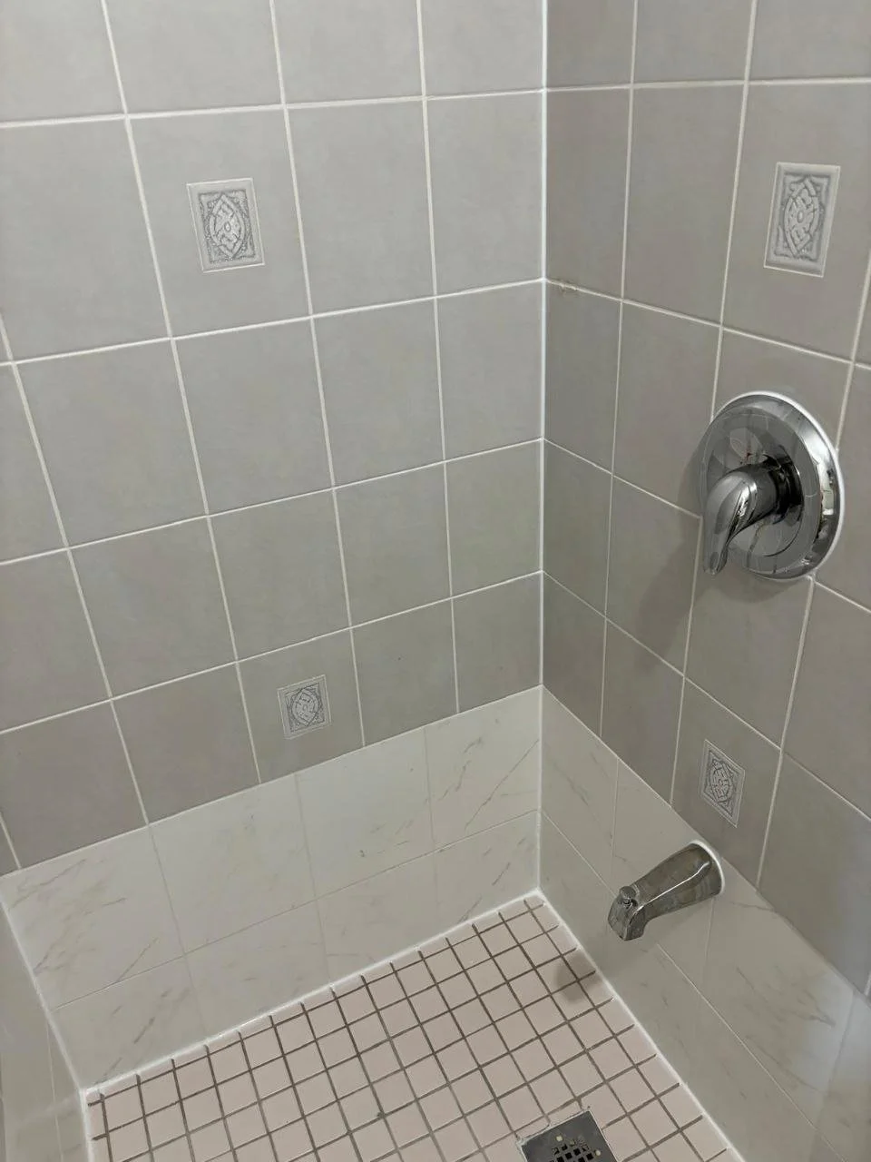 Newly restored shower showing shower wall, floor 