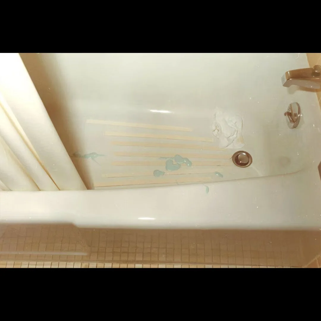 A tube of toothpaste that had been emptied into the bathtub