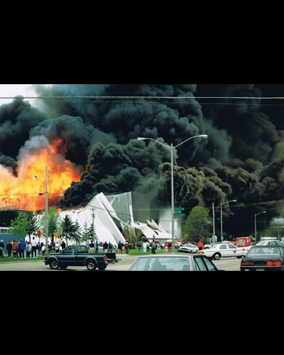 Onlookers watch as the fire blazes 