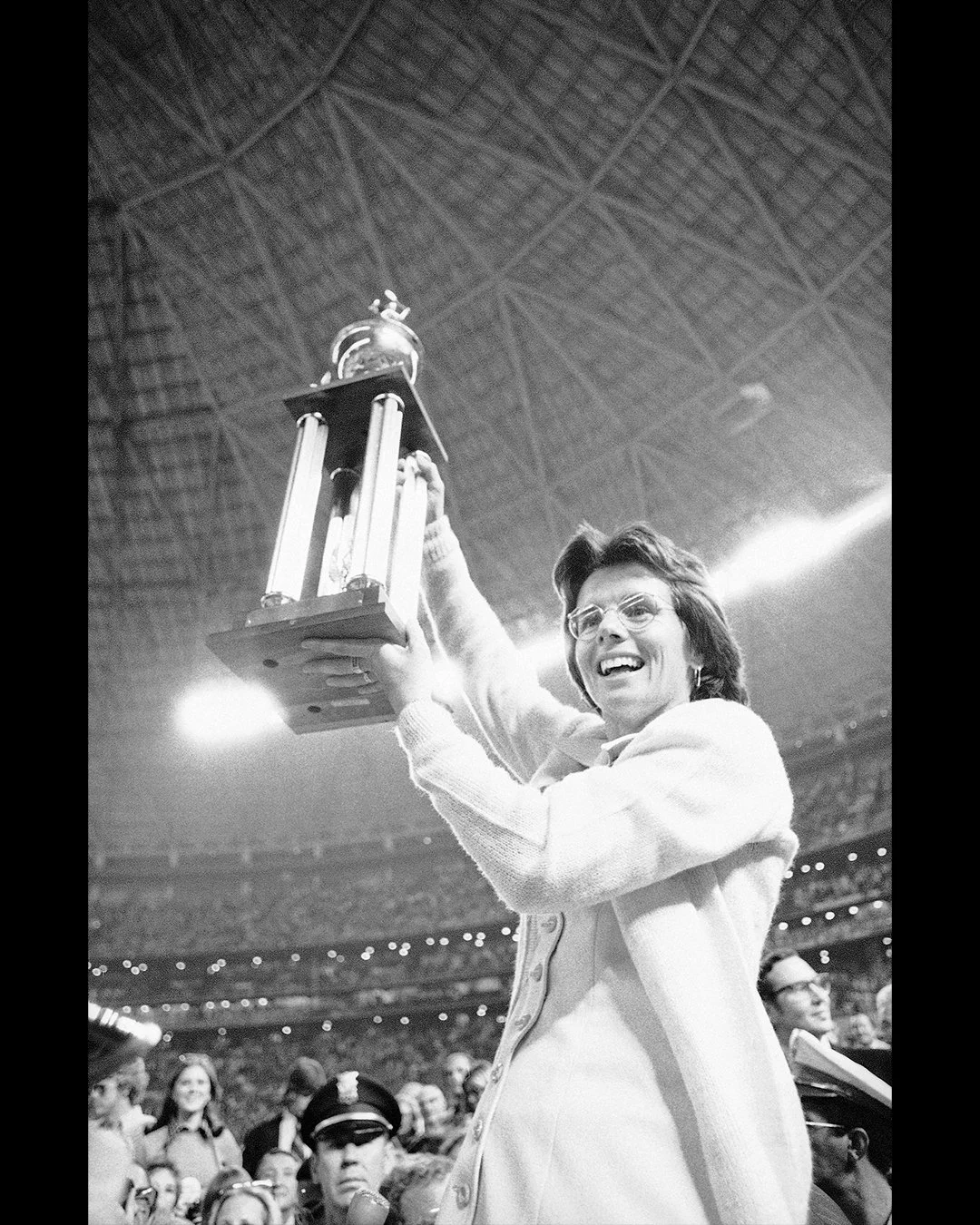 Billie Jean King holding the winner’s trophy