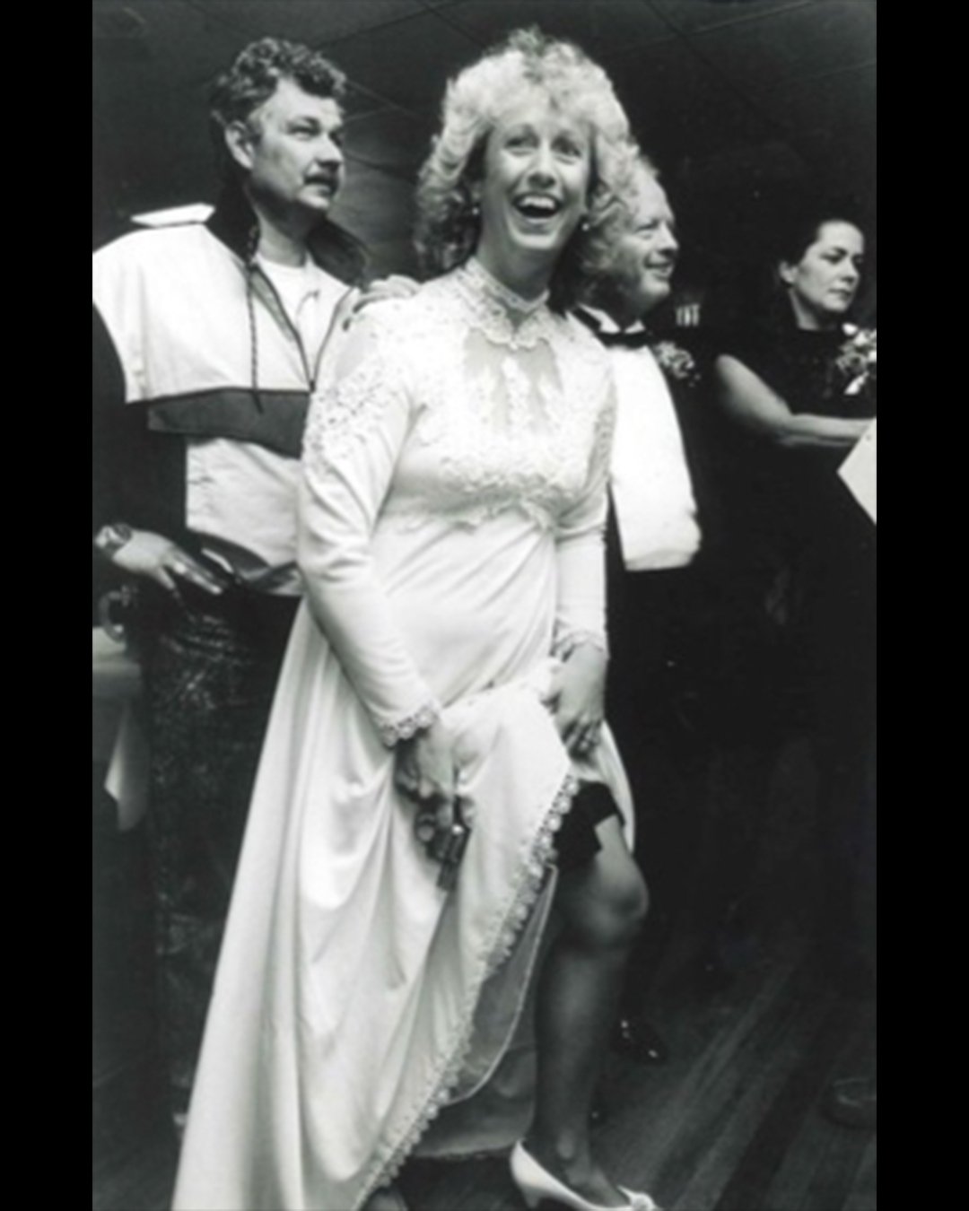 Debbie, with Vic Wasylyshyn standing behind her in the track suit
