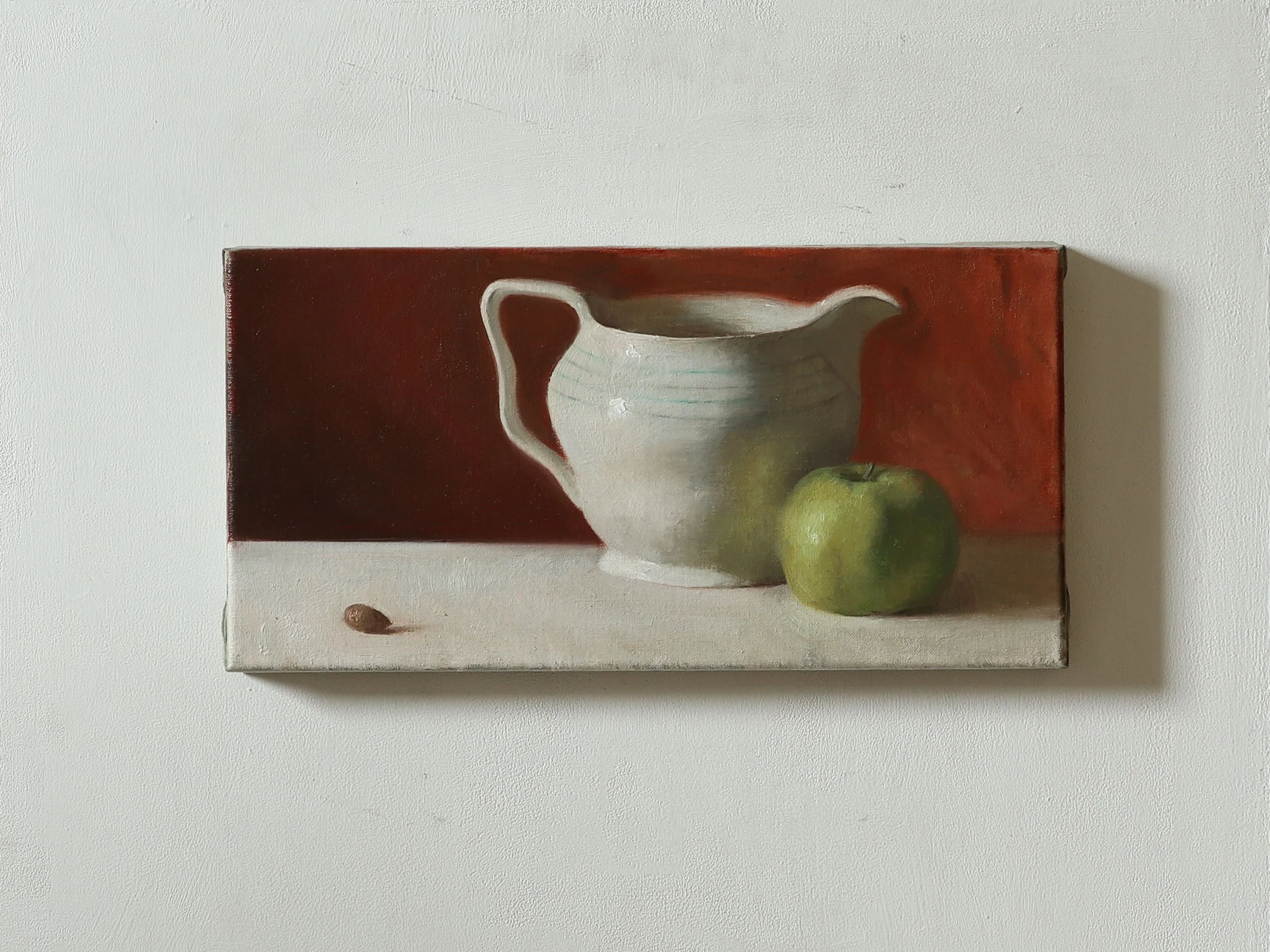 Jug, apple, and an acorn