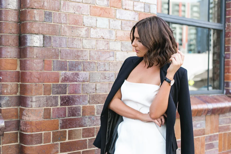 Editorial-style shot of Clare Hutton, career coach, in a chic outfit during her personal branding shoot, showcasing her professional style and confidence.