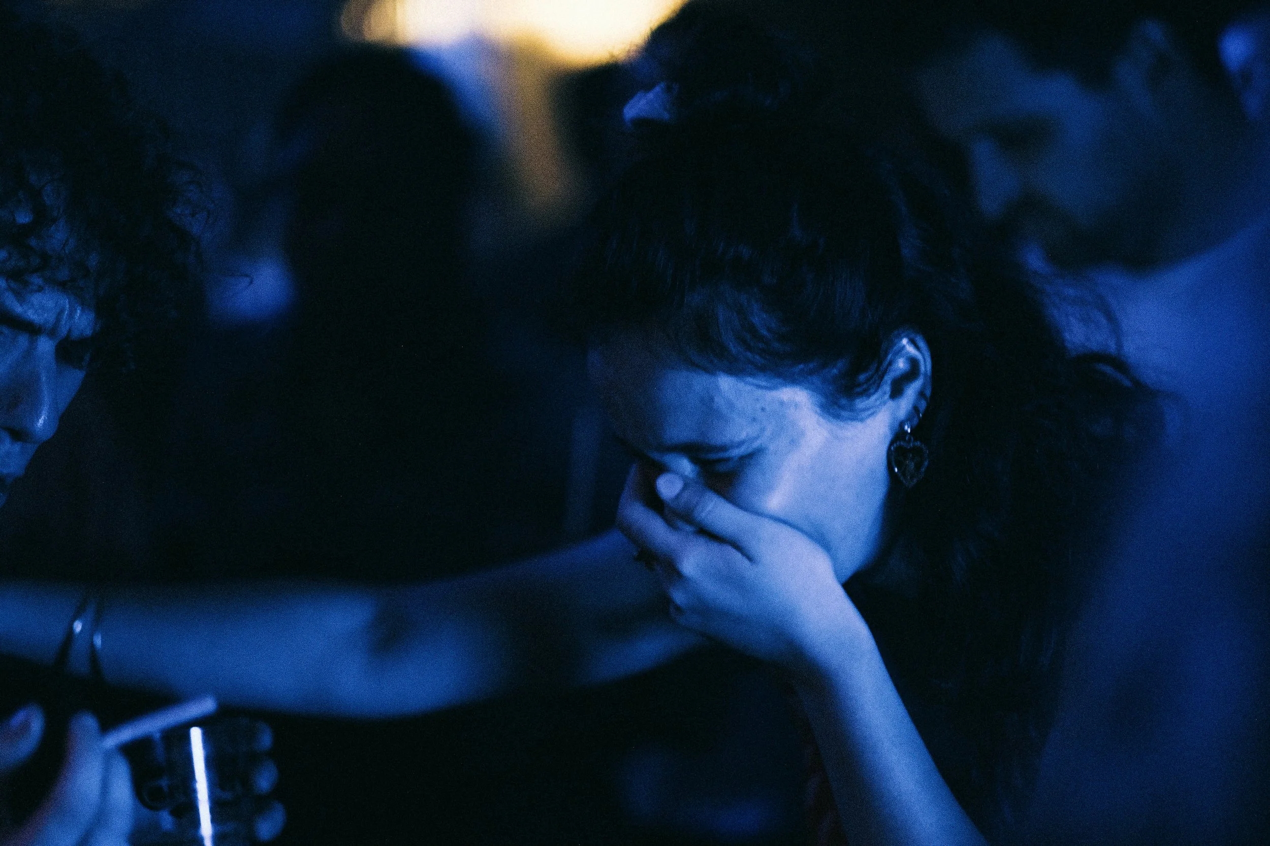 A women crying in blue light