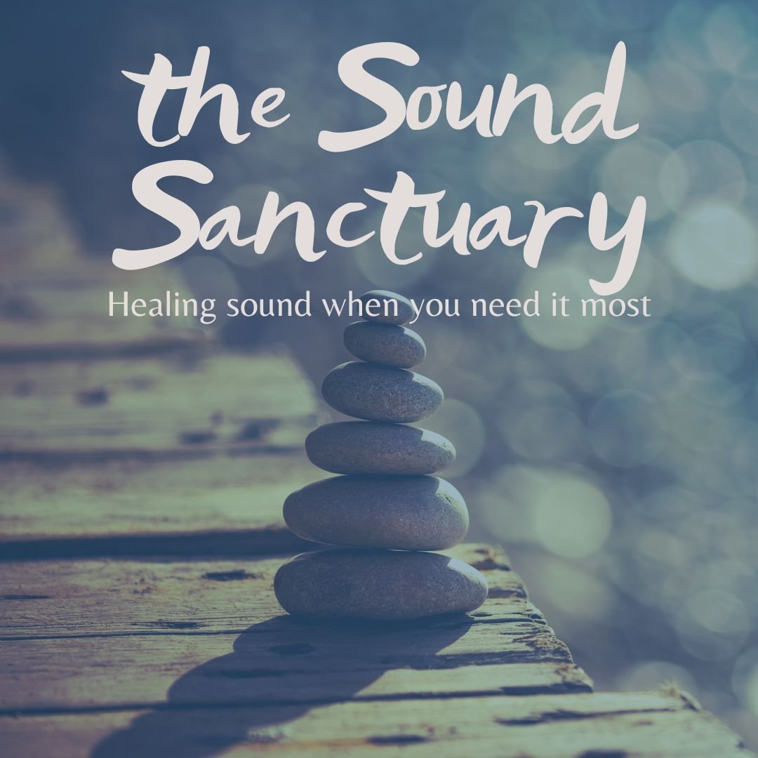 Photo of rocks balanced in a tower on a dock