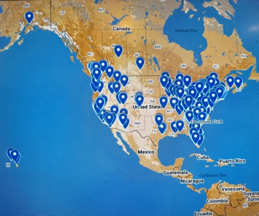 A map of North America displaying numerous blue location markers across the United States, with a few markers on Canada, Mexico, and Caribbean islands.