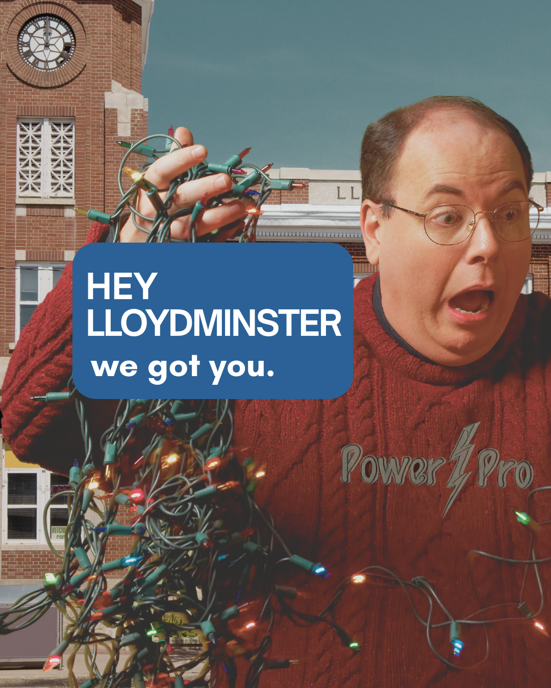 A man with glasses and a red sweater holding tangled Christmas lights in front of a brick building with a clock tower, looking surprised, with a caption saying 'Hey Lloydminster, we got you.'