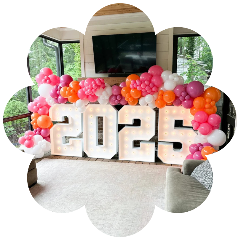 White bounce house and balloon garland for birthday in Alpharetta GA