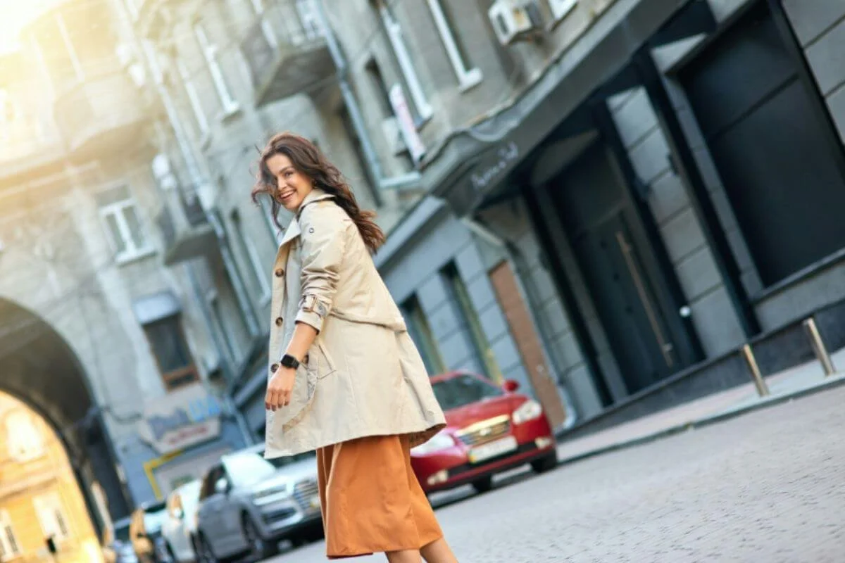 Woman walking confidently through the city, representing rebuilding capacity, resilience, and sustainable performance